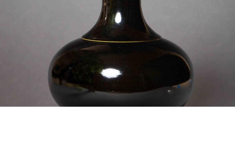 Material: Ceramic 
Origin: China
Age: Ching dynasty, Tung-Chih period, circa 1870
Size: 15 inches in height

We have a nice collection of black vases currently. As well as oxblood Chinese vases.

As designers we plant these vases with orchids