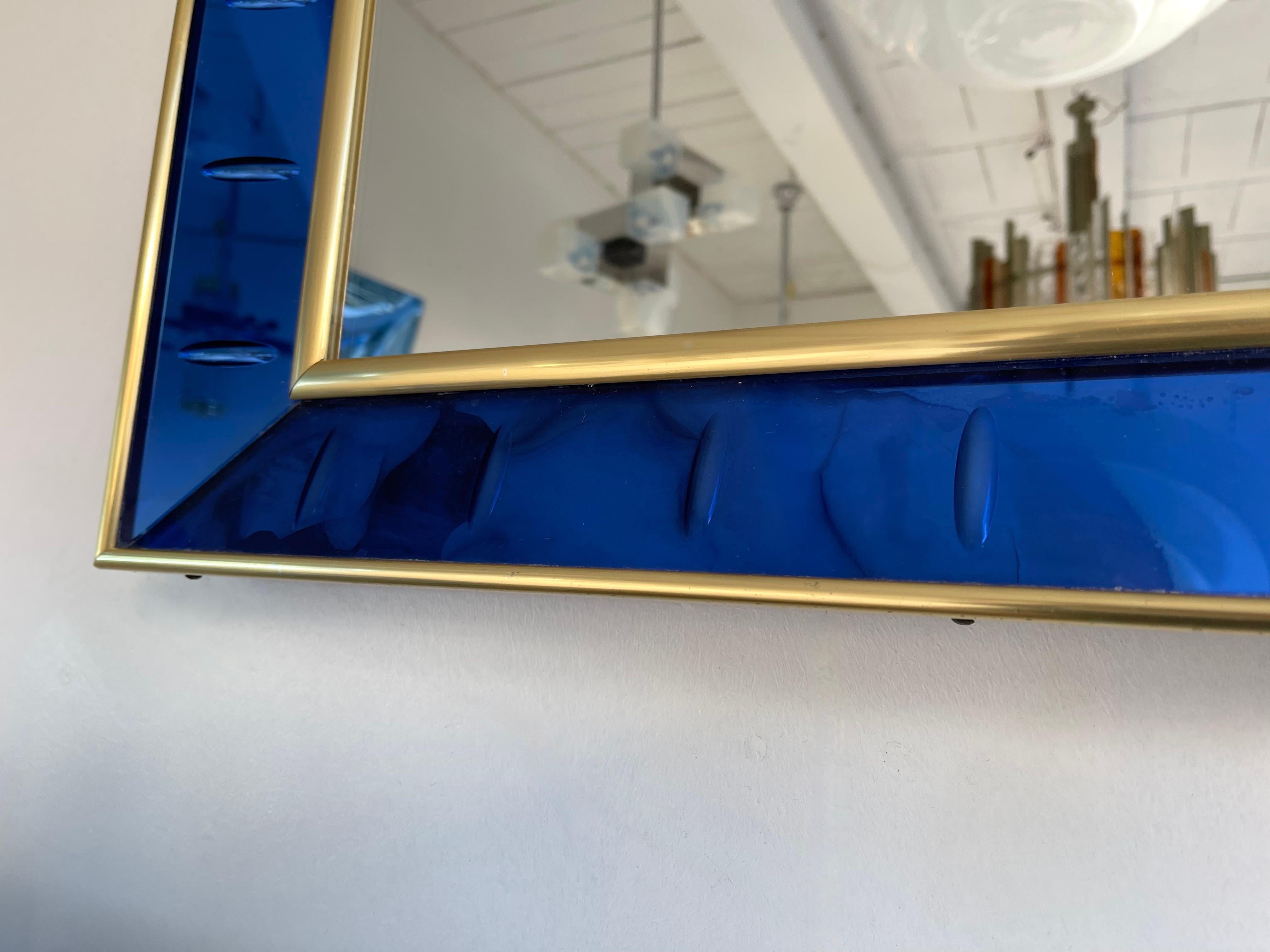 Mirror blue with brass frame by Cristal Art. Famous manufacture like Fontana Arte.