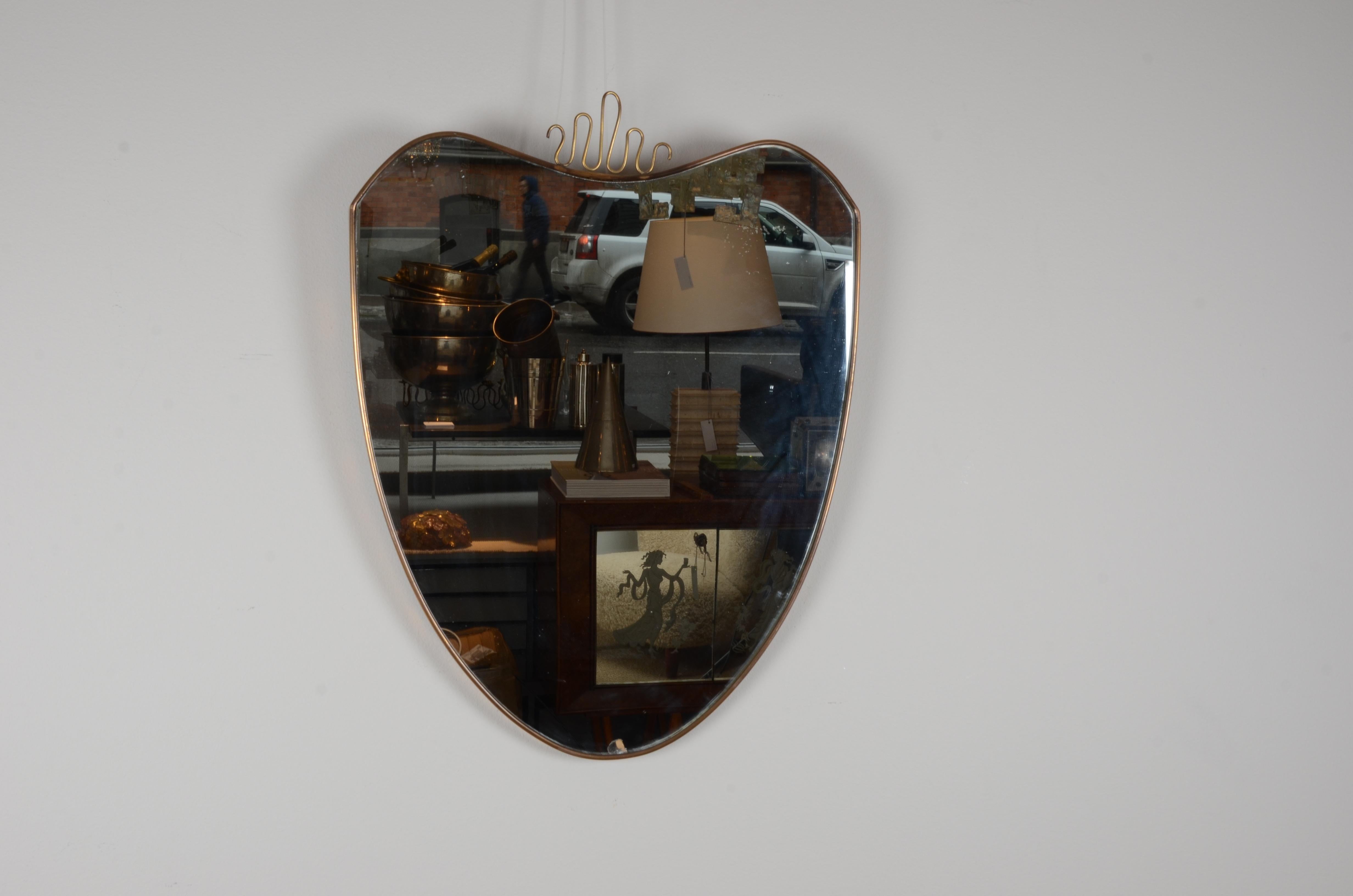 Italian brass mirror, mid-1900s.

Smaller damages on glass, signs of age.