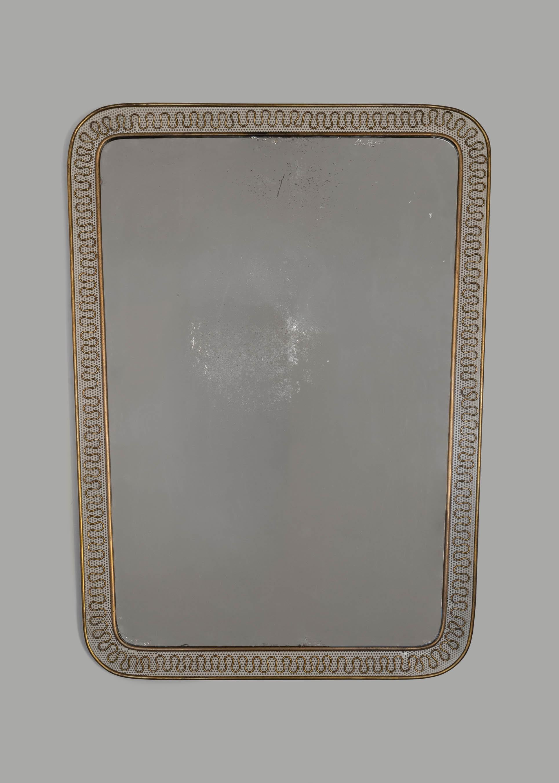 Italian brass and perforated metal mirror by Carlo Erba. Made in Italy circa 1950s.