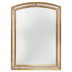 Mirror by Deknudt with marbled fume glass side panels in gilded wooden frame