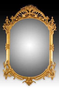 Specchio. Madre intagliata e dorata. XX secolo.