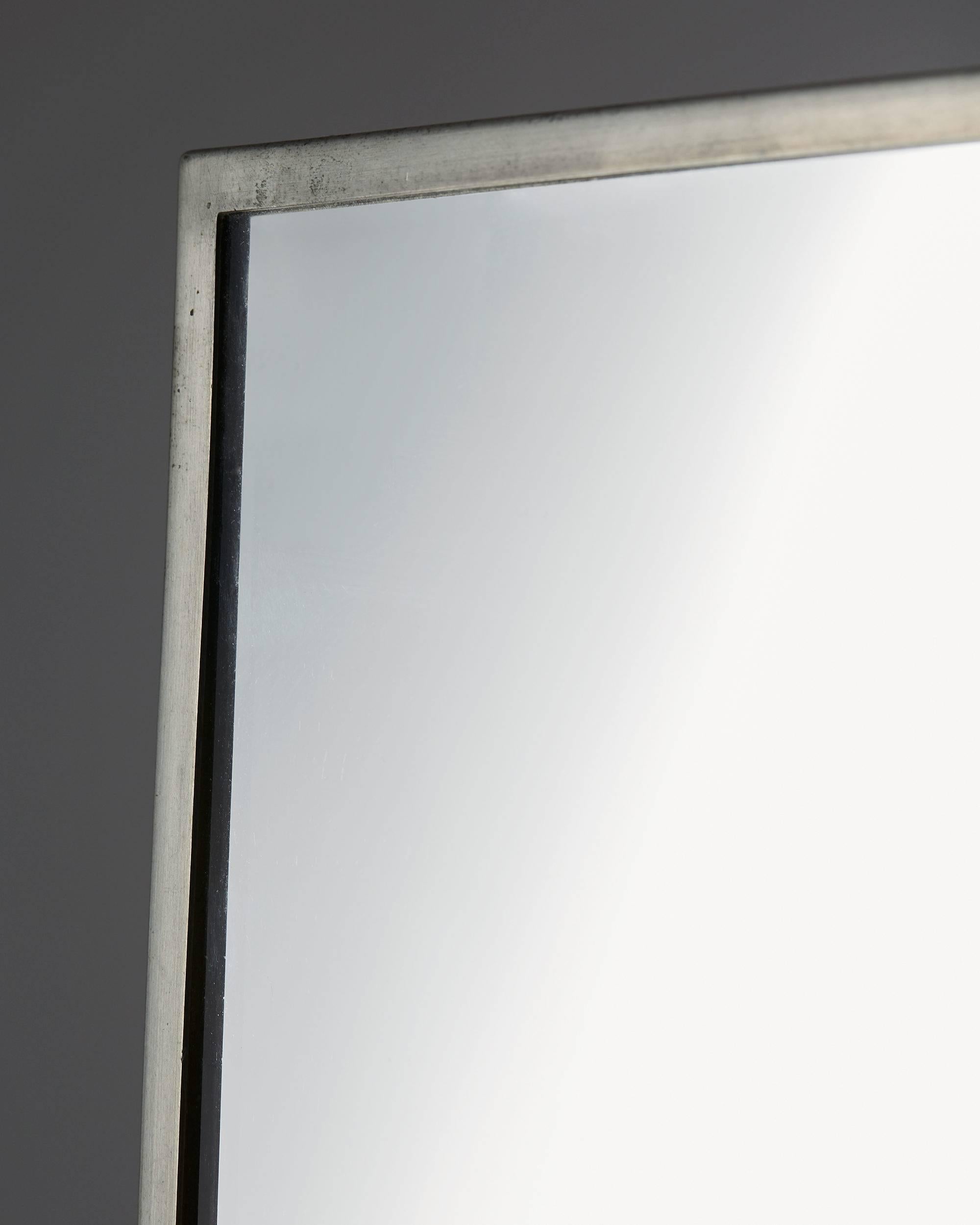 Mirror, anonymous,
Sweden, 1930s.

Pewter and mirrored glass.

Measurements: 
H: 161 cm/ 5' 3 1/2