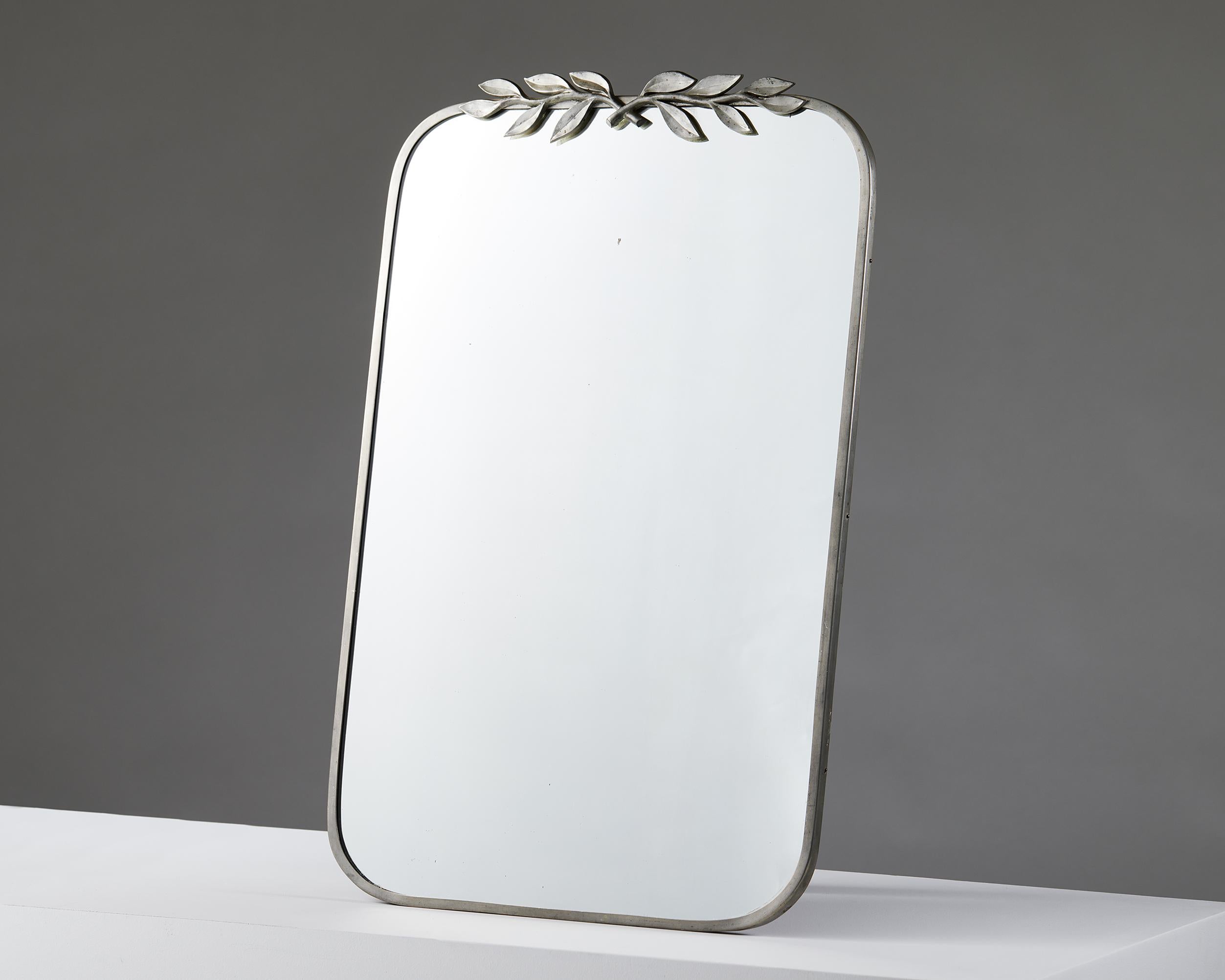 Mirror designed by Estrid Ericson for Svenskt Tenn,
Sweden, 1930.

Pewter and mirror.

Measures: H: 62.5 cm / 2' 1/2''
W: 41 cm / 16''
D: 2 cm / 3/4''.