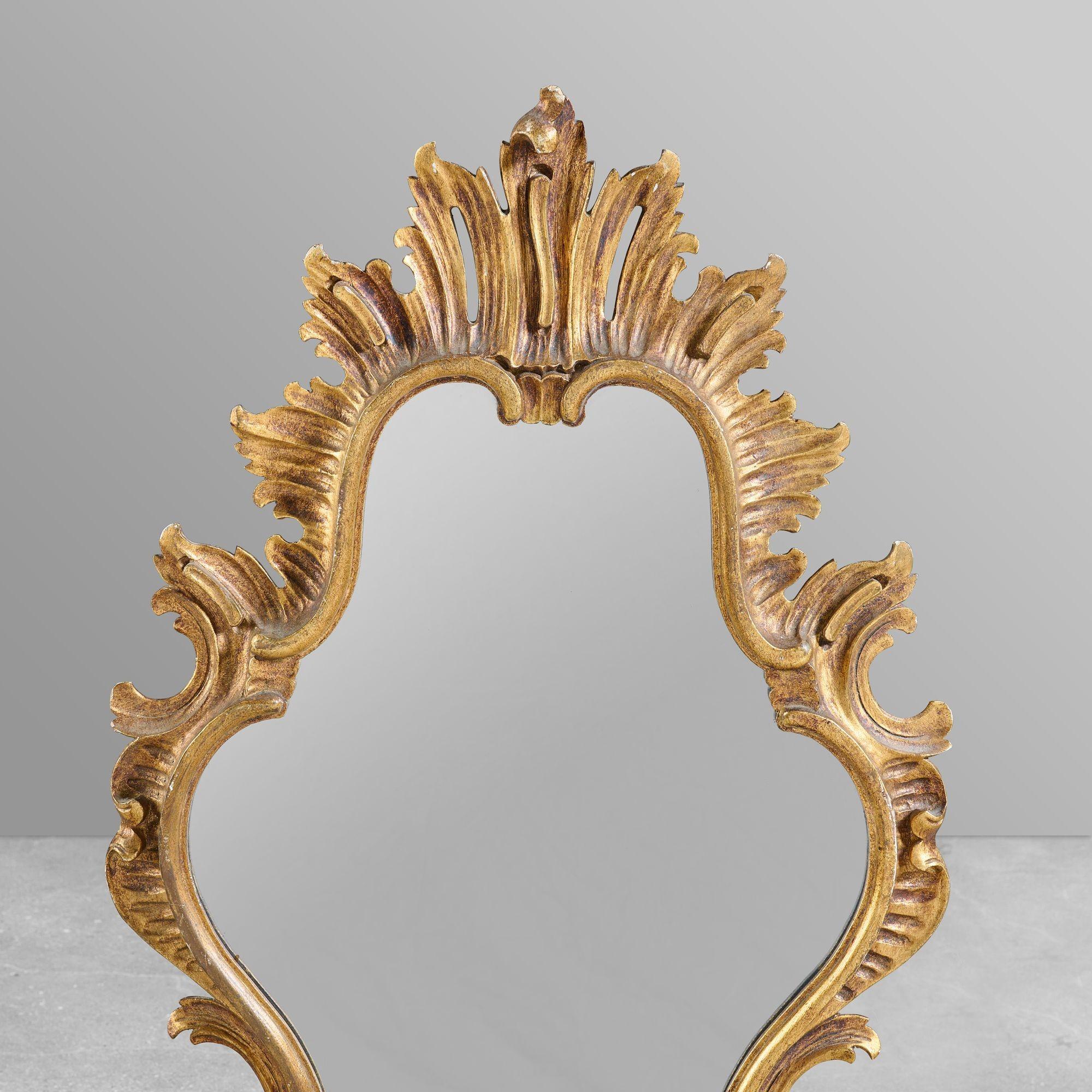 Decorative carved wood and gesso mirror.