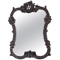 Miroir des années 1920-1930 dans un cadre néo-rococo