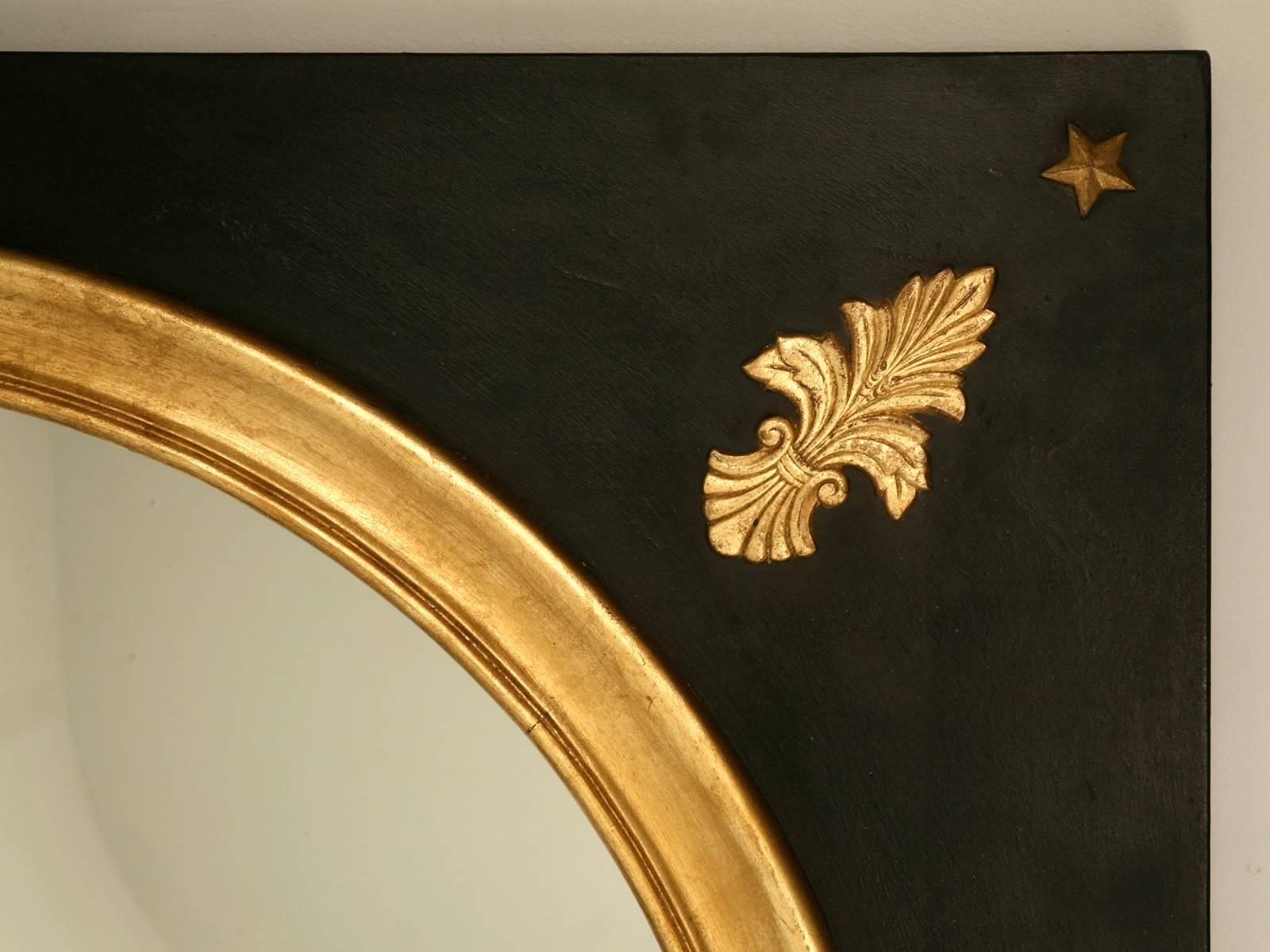 Custom mirror, handmade in our workshop, from solid wood in a beautiful black painted frame, complimented with carved gilded highlights.