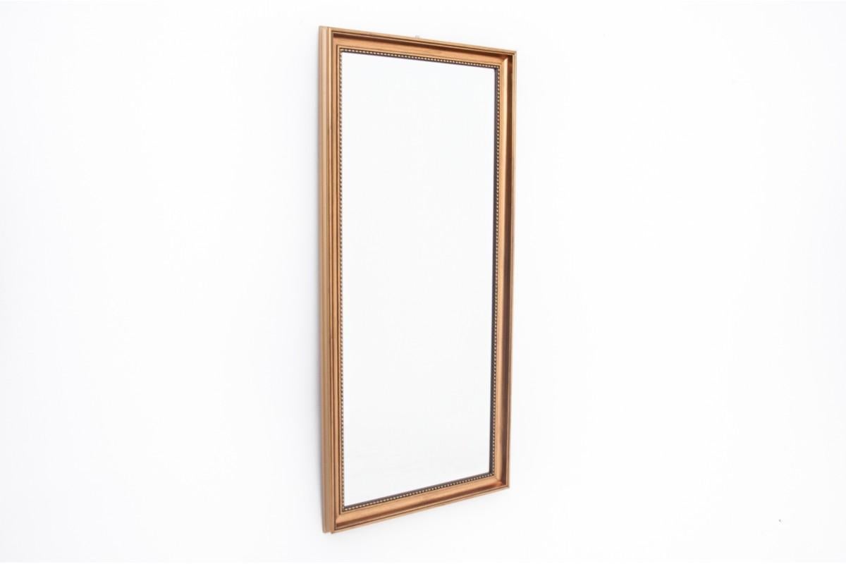 Mirror in a gold frame.

Dimensions: height 130 cm / width 62 cm