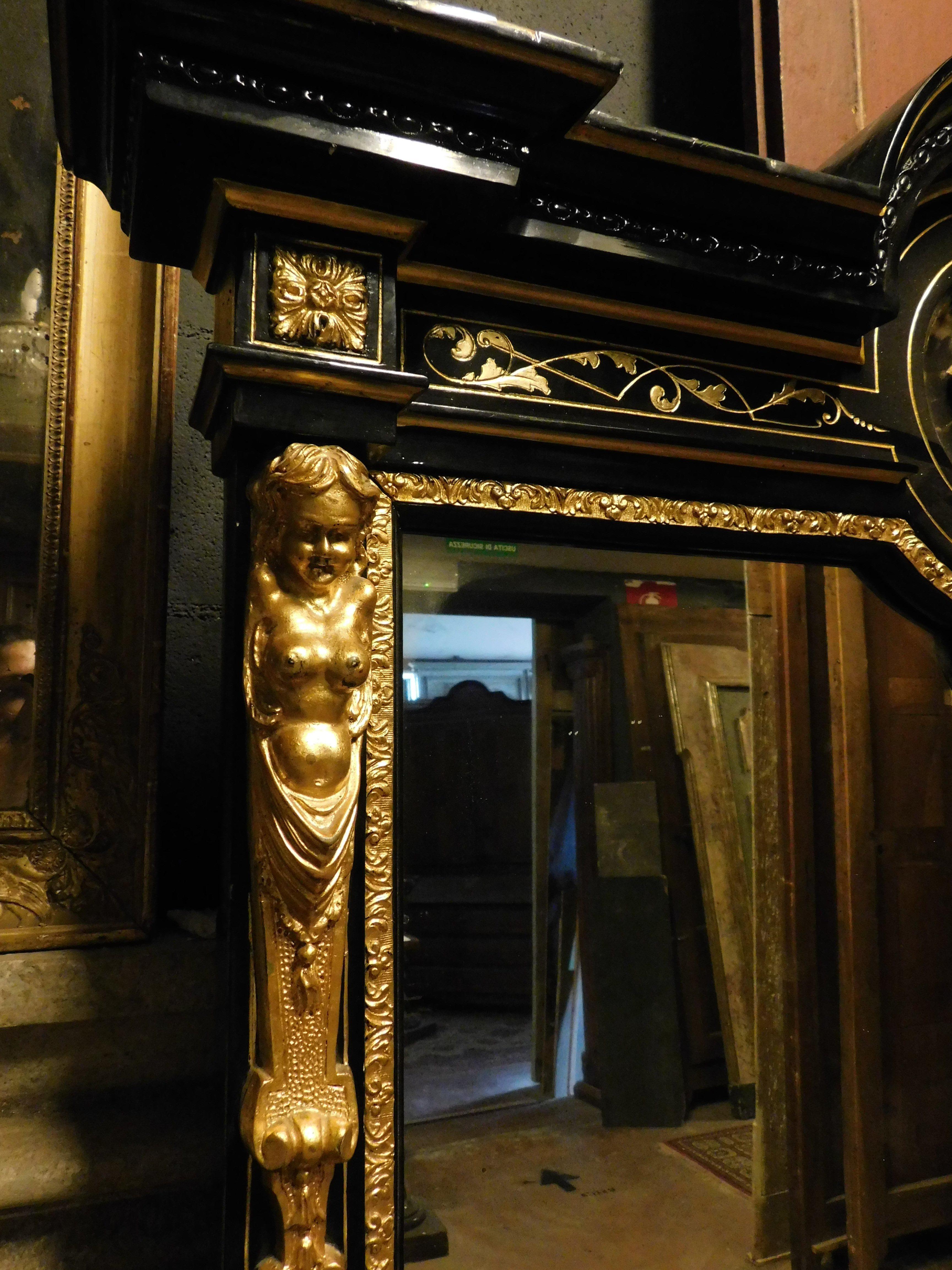 Wood Mirror in black lacquered wood, with rich golden sculptures, Italy For Sale