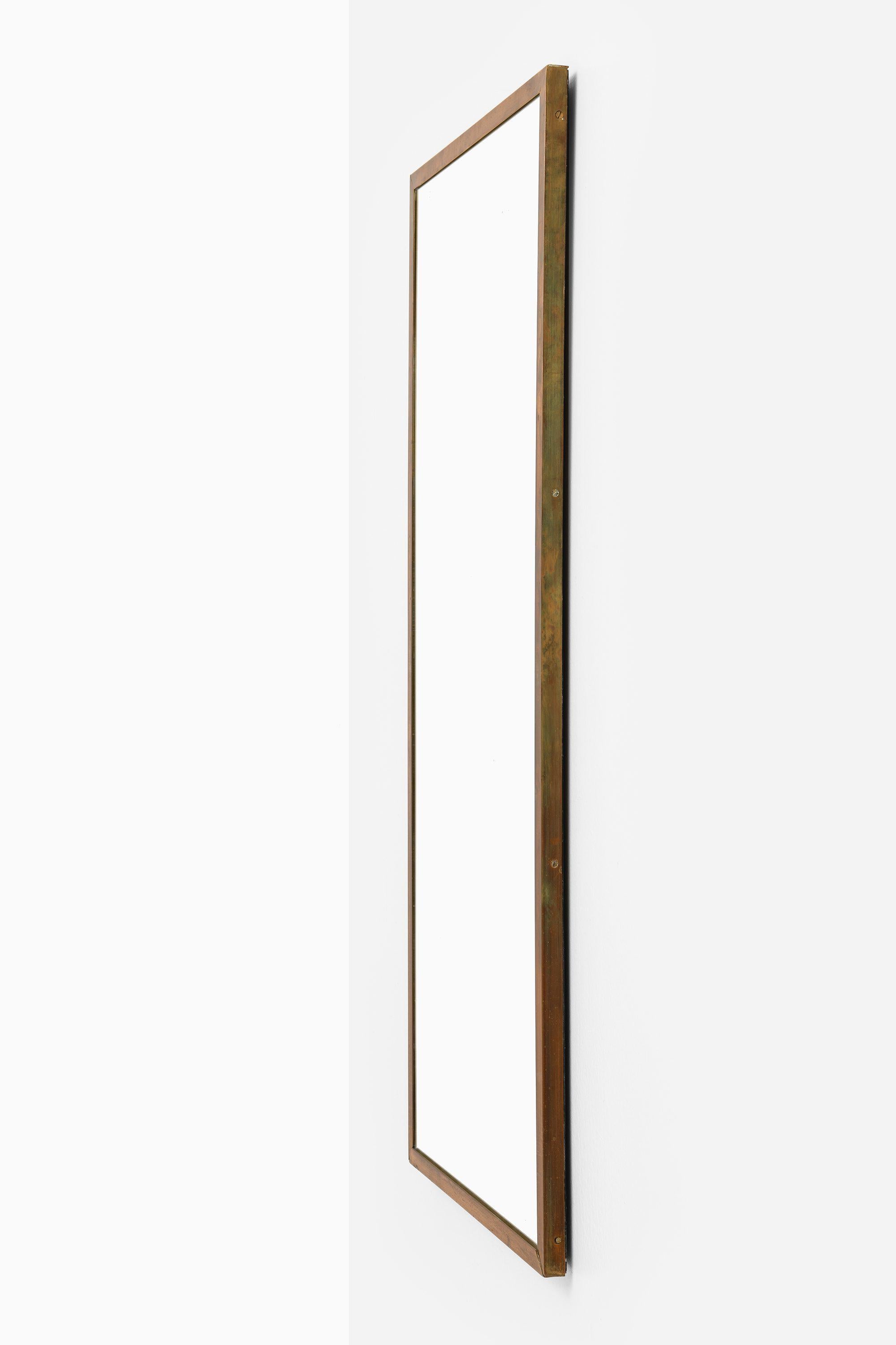 Mirror in Brass Attributed to Josef Frank, 1950's

Additional Information:
Material: Brass
Style: Mid century, Scandinavian
Produced in Sweden
Dimensions (W x D x H): 48 x 3 x 104.5 cm
Condition: Good vintage condition, with signs of usage and patina