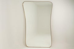 Mirror in brass in the style of Gio Ponti. 1980s/1990s.