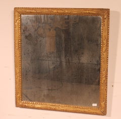 Miroir en bois sculpté et doré d'époque Louis XVI XVIII