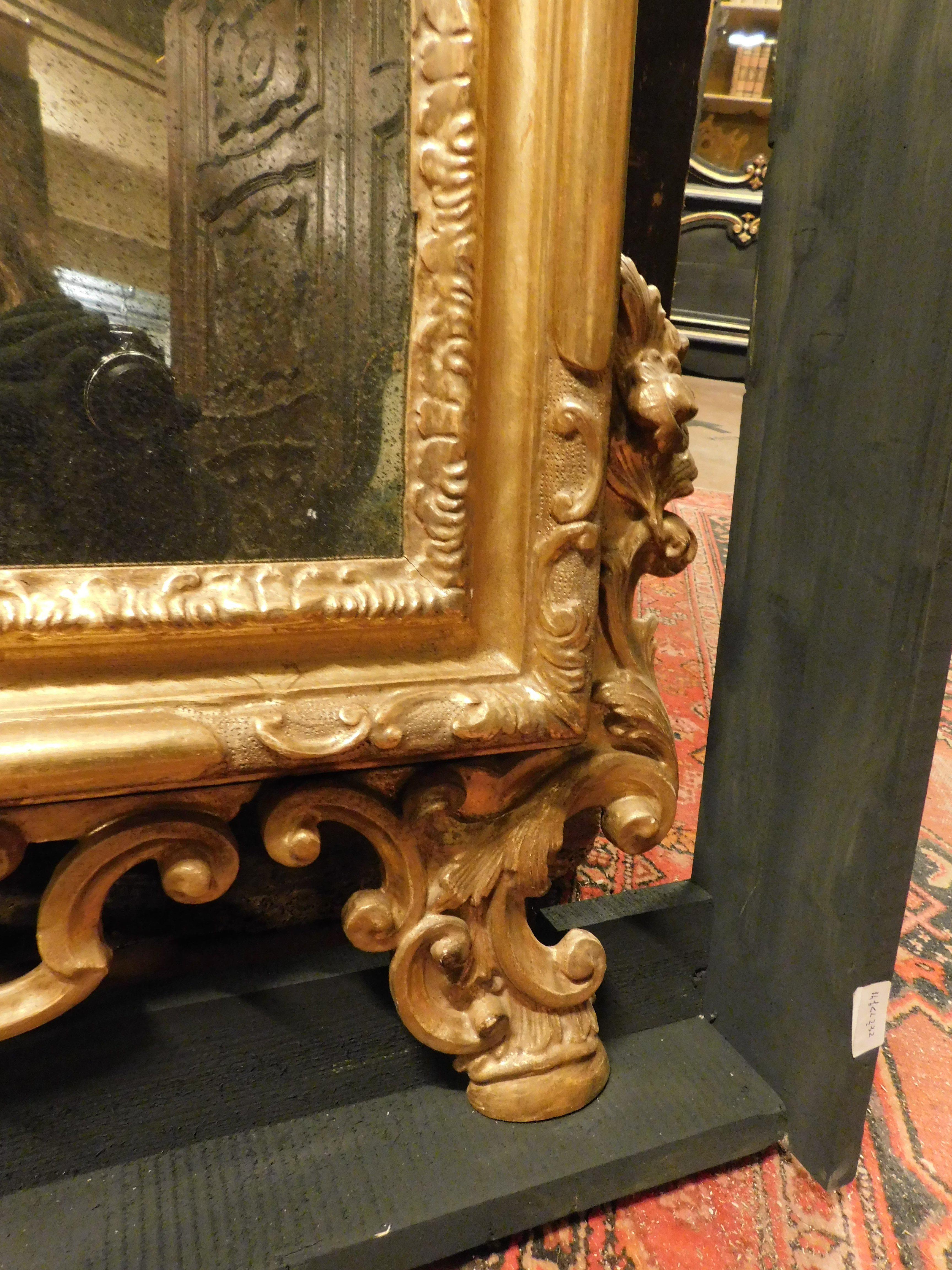 19th Century Mirror in gilded wood, richly frieze perforated volutes, floral and leafy, '800 For Sale