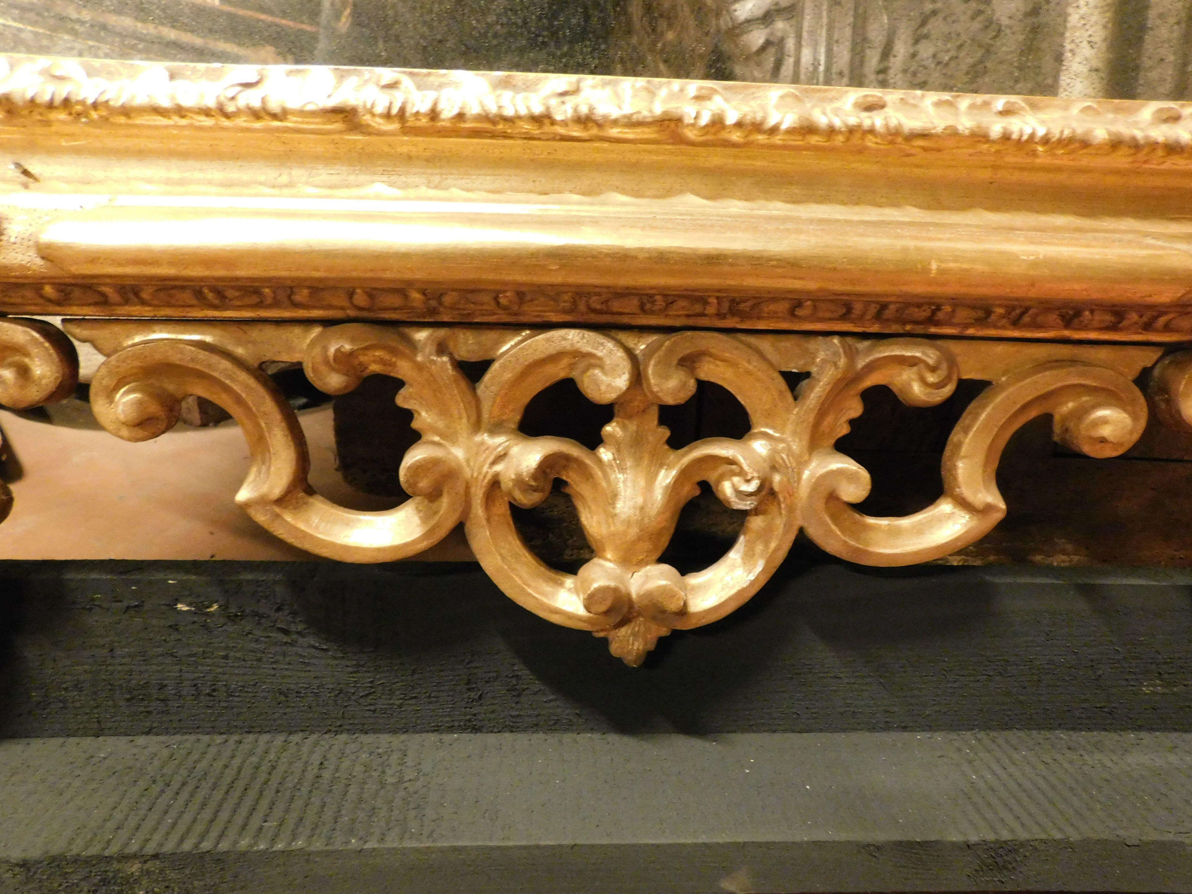 Mirror in gilded wood, richly frieze perforated volutes, floral and leafy, '800 For Sale 1