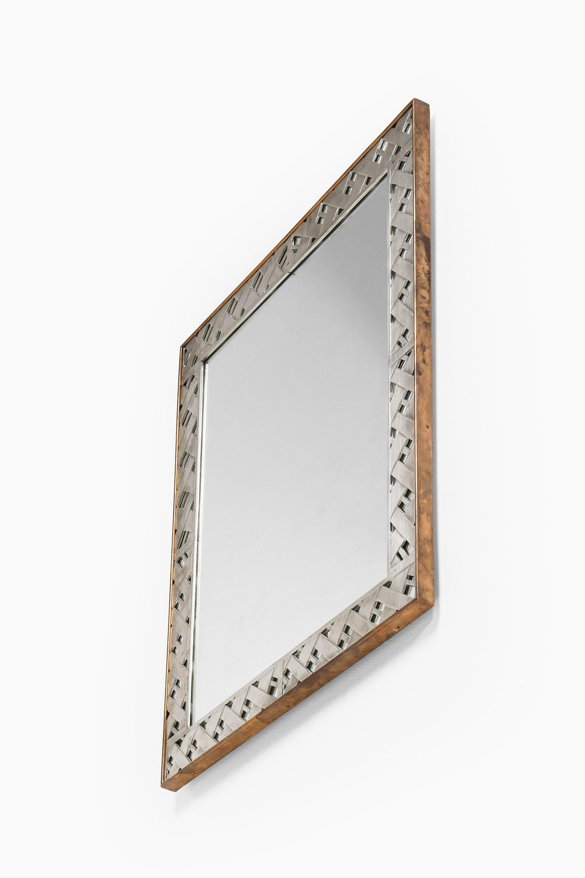 Scandinavian Modern Mirror in Pewter with Brass Frame by Björn Trädgårdh, 1930-1934, Svenskt Tenn For Sale