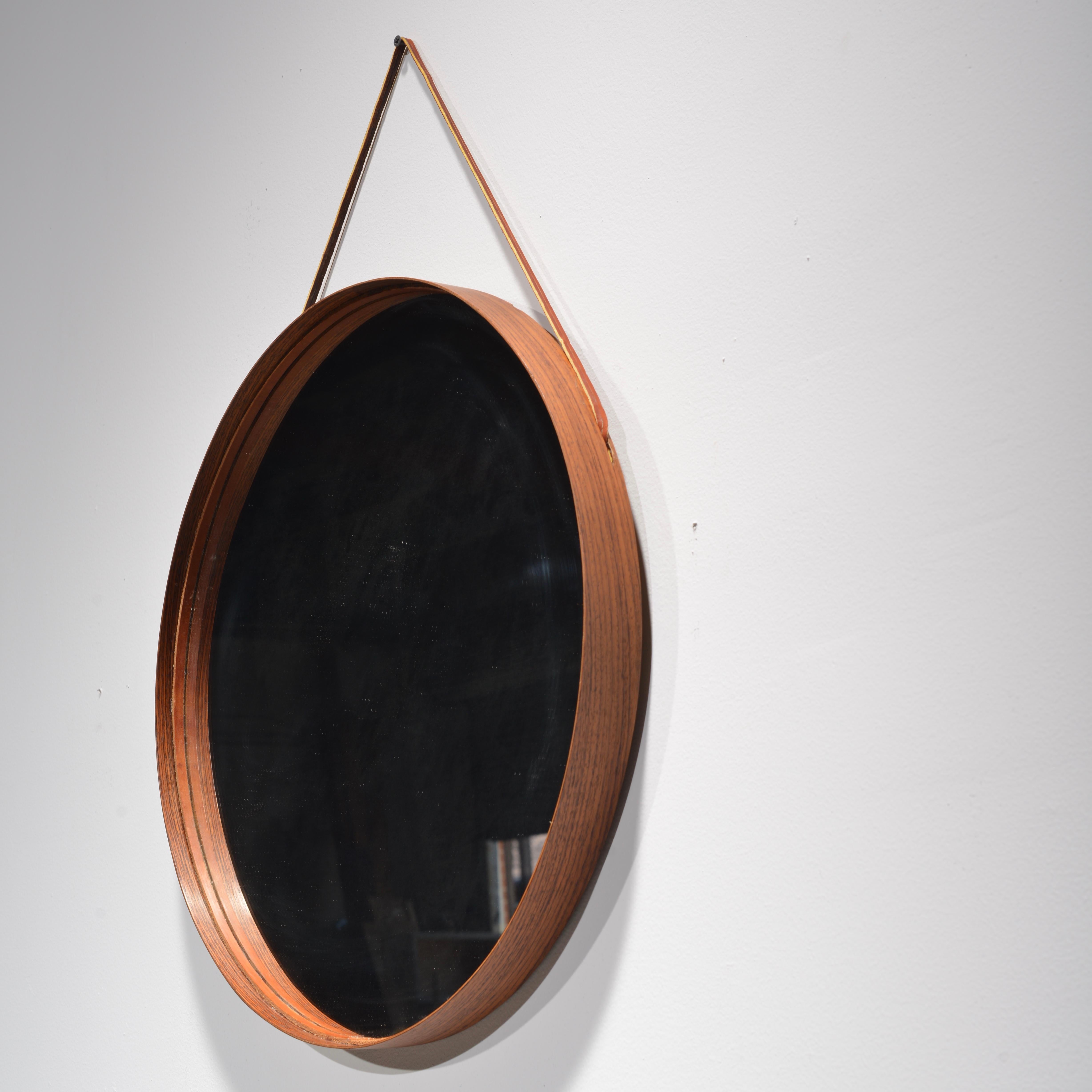 Rosewood and leather round wall mirror by Uno & Osten Kristiansson for Glas Mäster.