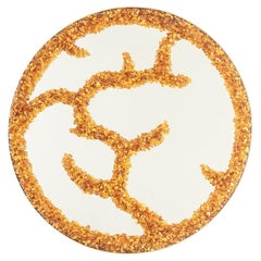 Mirror in semi-precious stones in a circular shape. Artisan work.