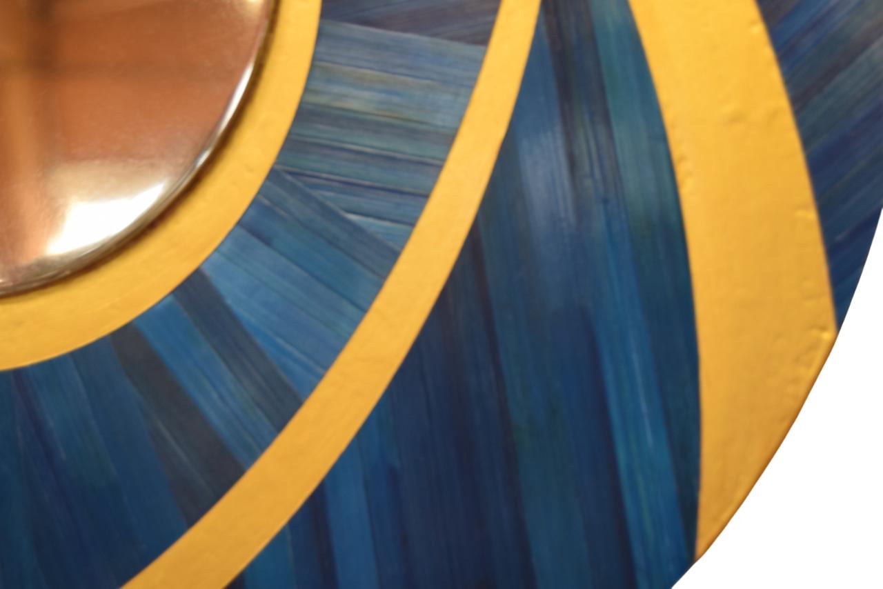 beautiful mirror in straw marquetry and gold lacquer, mirror center in hand-polished stainless steel, by les2ebenistes
circular mirror in polished stainless steel, 1 cm thick, outline in blue straw marquetry with kinetic motifs and gilded
