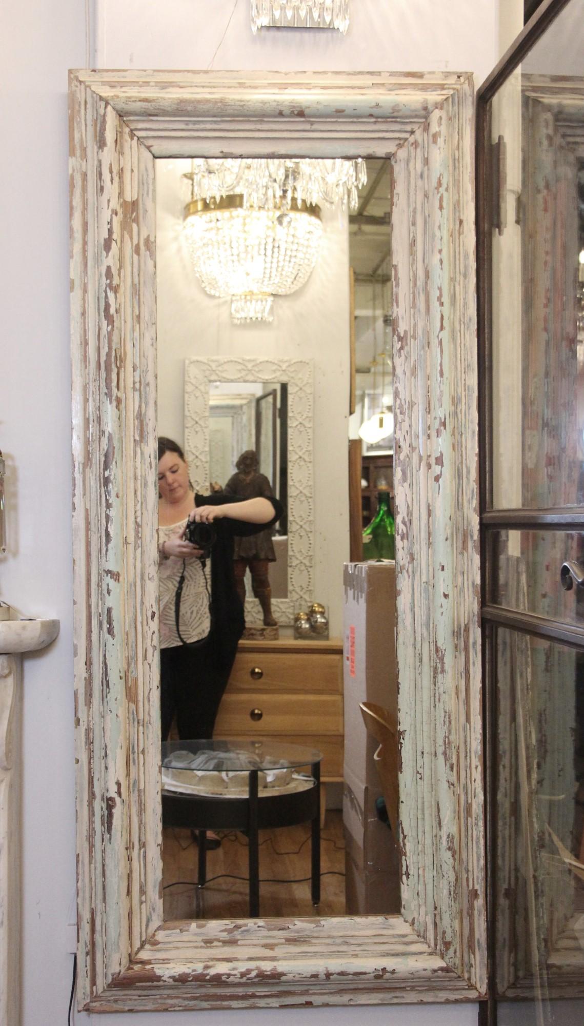 Mirror made from upcycled entrance door molding from an 1800s brownstone. Original muted paint colors are accented with a satin lacquer finish. This can be seen at our 333 West 52nd St location in the Theater District West of Manhattan.