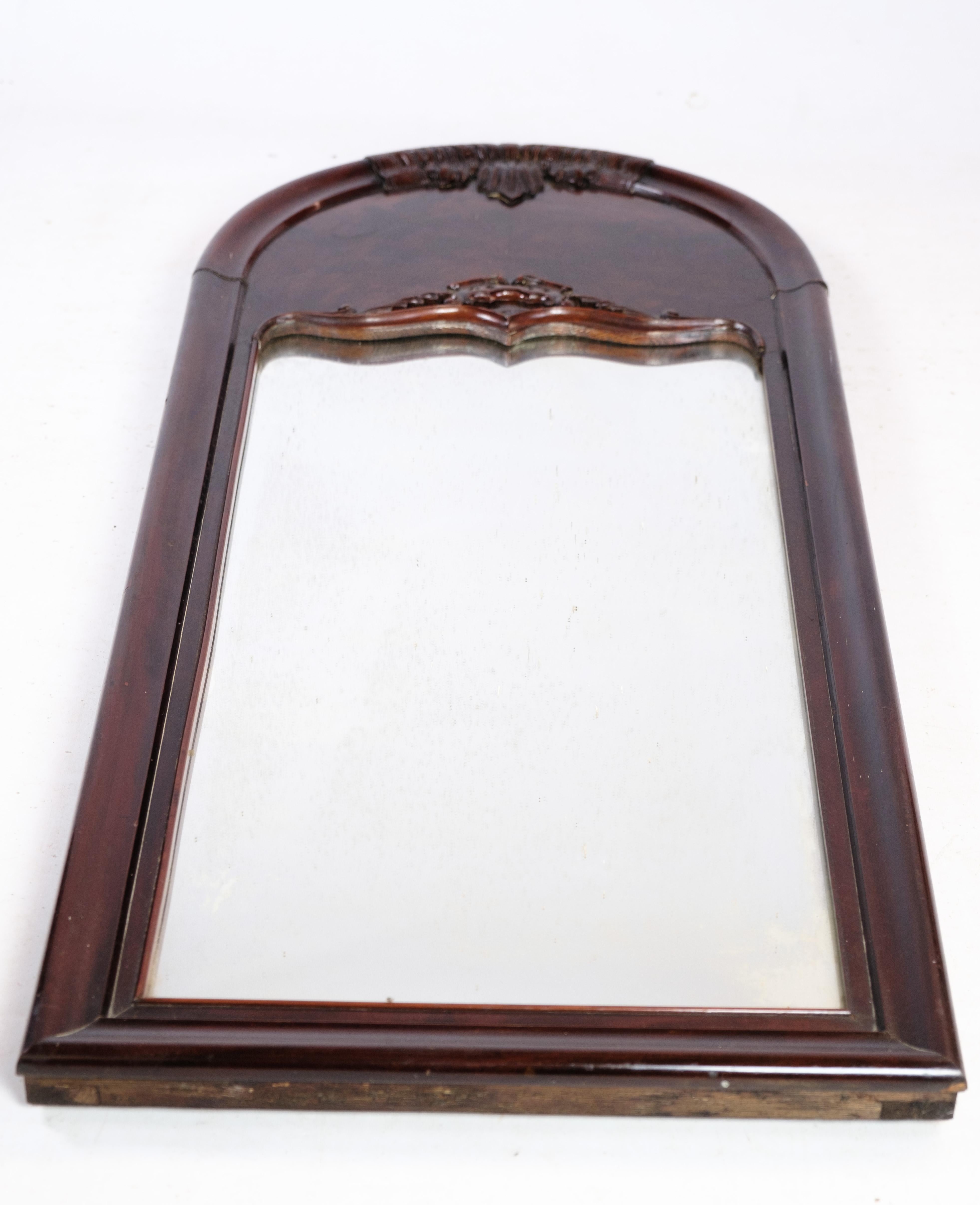Mirror of hand-polished mahogany, with carvings, made in Denmark from around the 1880s.
Dimensions in cm: H:118 W:53

This product will be inspected thoroughly at our professional workshop by our educated employees, who assure the product quality.