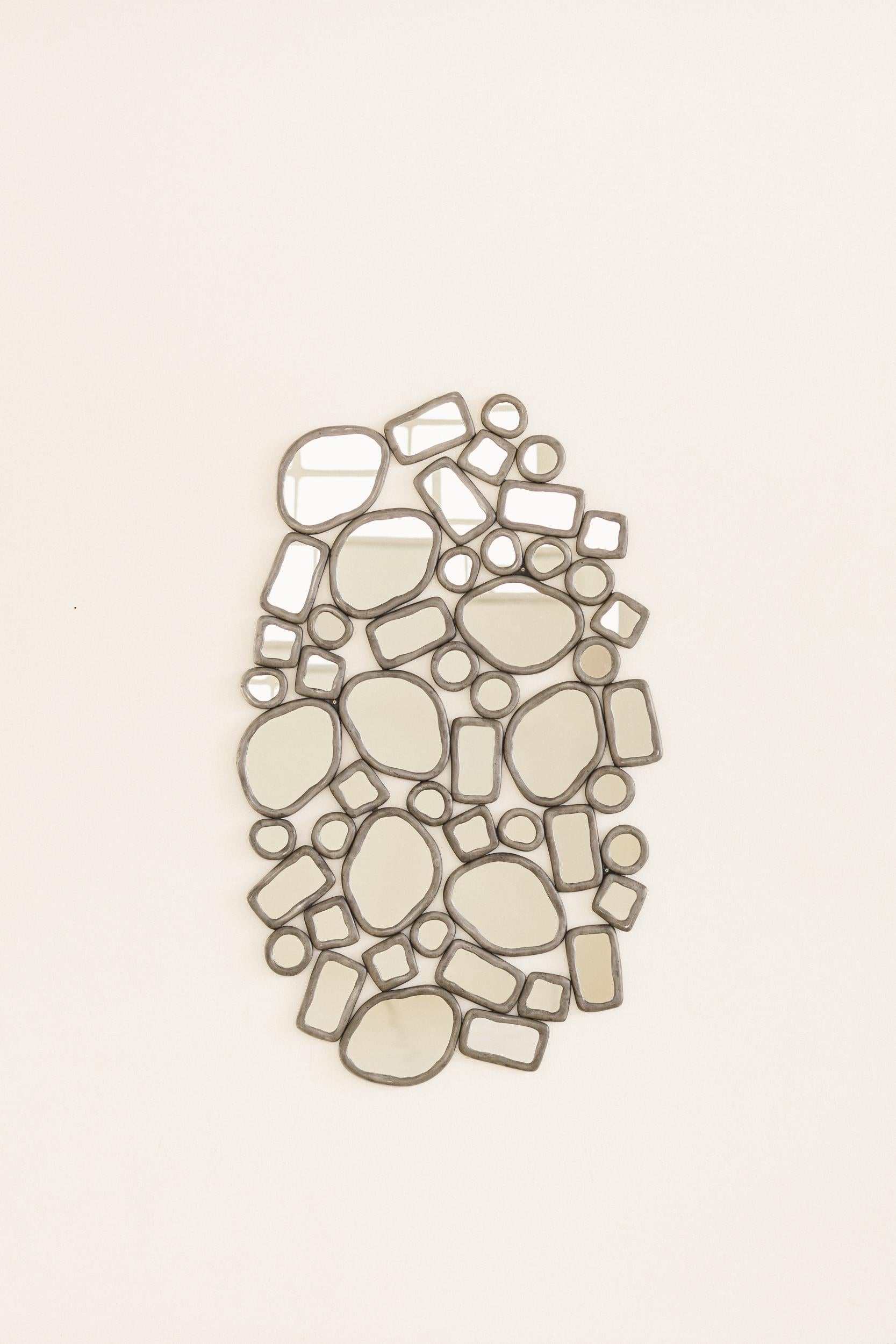 In the collection titled Material Distortion, Recchia reinterprets the historical practice of embedding glass in metal, a technique that dates back to the stained-glass traditions of the early Middle Ages and later found expression in decorative