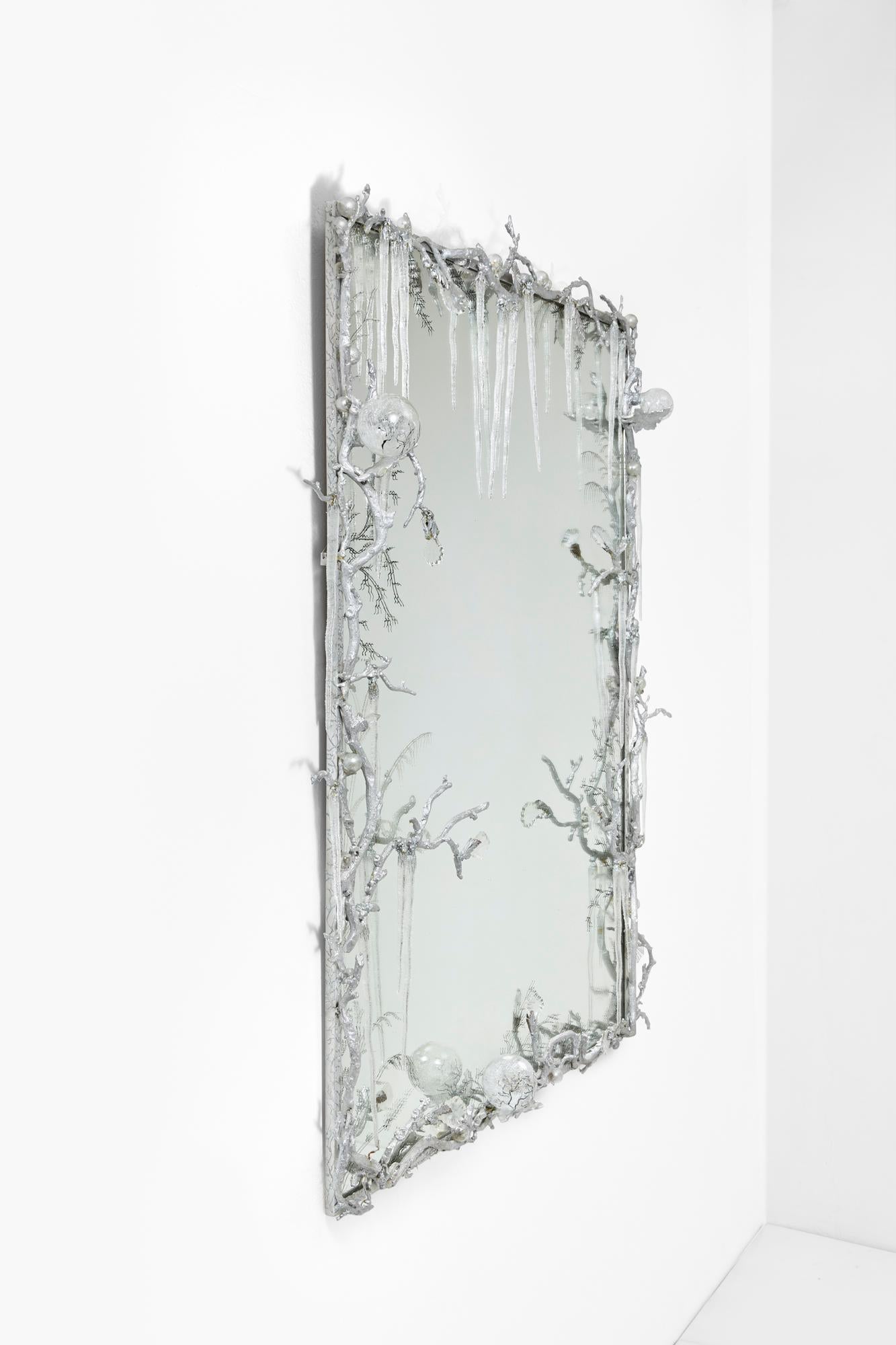 Frame made with a composition of silvered aluminium branches, and glass ornementation for the stalactites.
Unique piece.