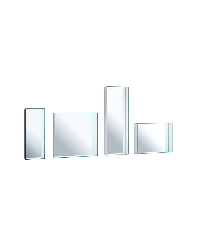 Mirror Mirror small wall mirror is shown here in the rectangular shape. Collection of square and rectangular mirrors available in different sizes, realized by gluing 45° laminated double faced mirror slabs. Two sizes are available as well with