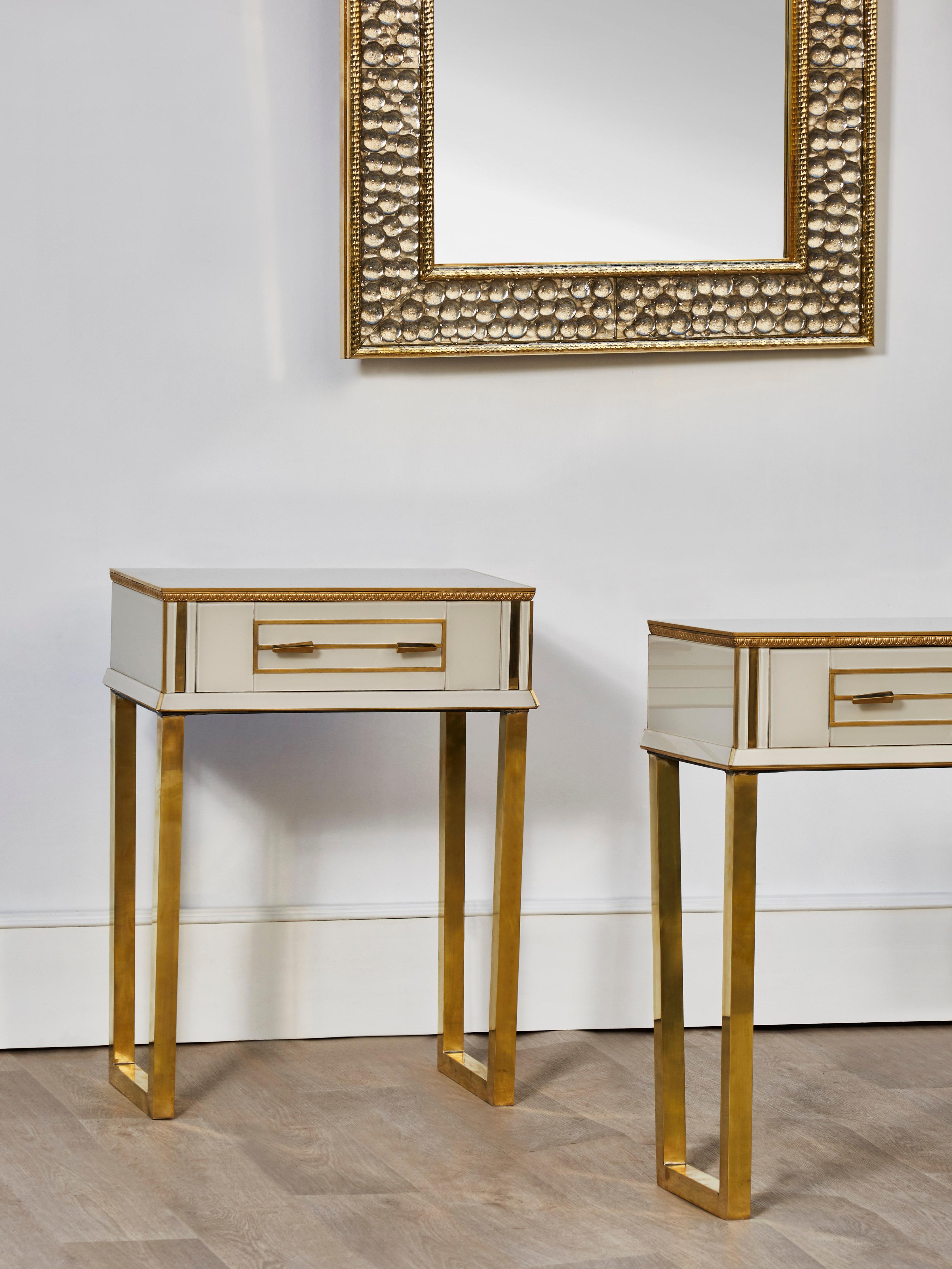 Elegant vintage nightstands entirely restored and customized with tainted mirrors and brass inlays. 1 drawer.
Brass feet have been polished.
Italy, 1970s.