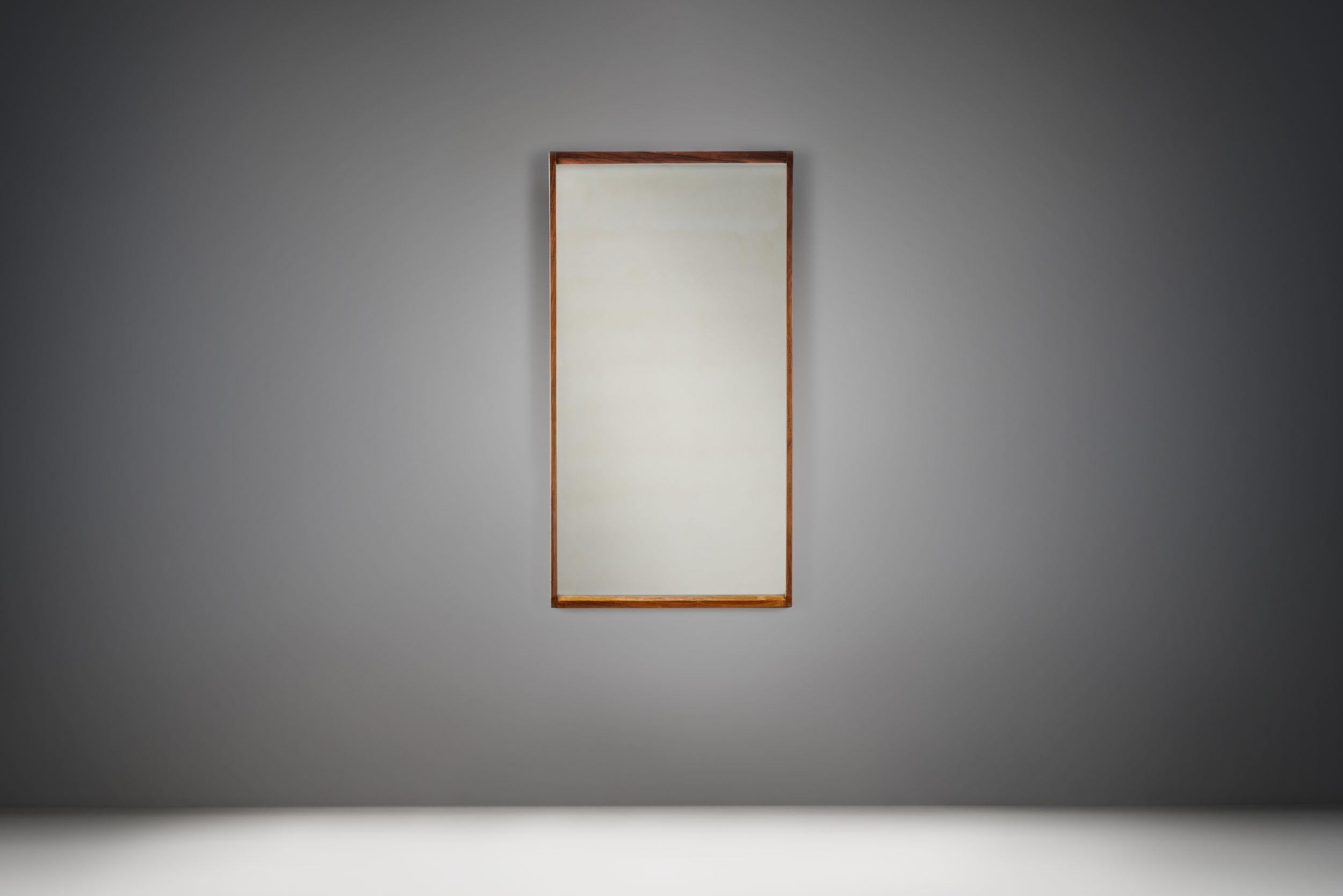 This mirror is from the famed “Hallmöbel” (Hall furniture) series by Danish designer Kai Kristiansen. With an overall look and details that represent mid-century Danish Modernism, this “No. 146” mirror is rooted in tradition.

As it can be