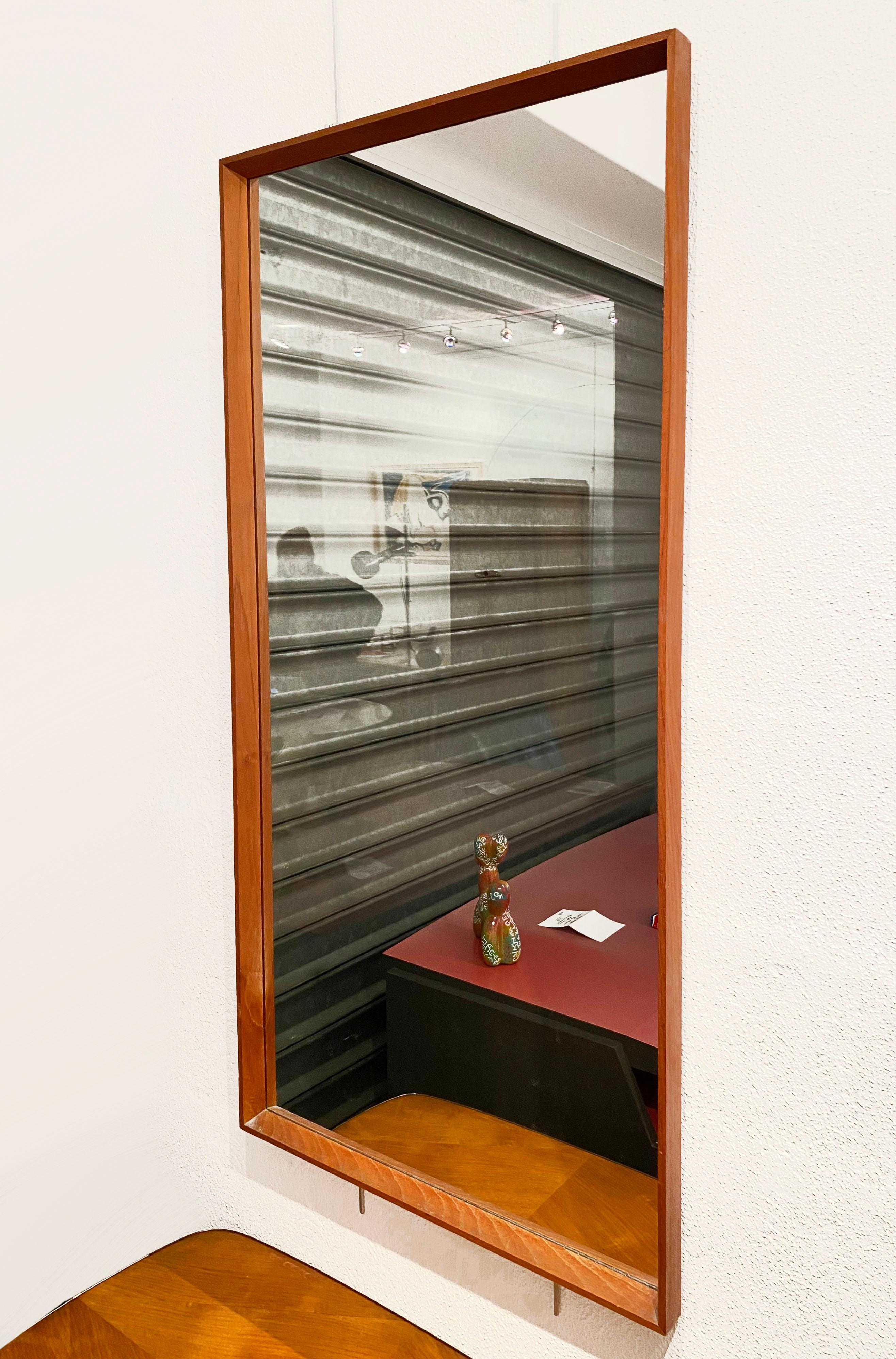 Mirror - North American, circa 1975.
Rosewood

Measures: L 59 x H 122 x W 3.5 cm.