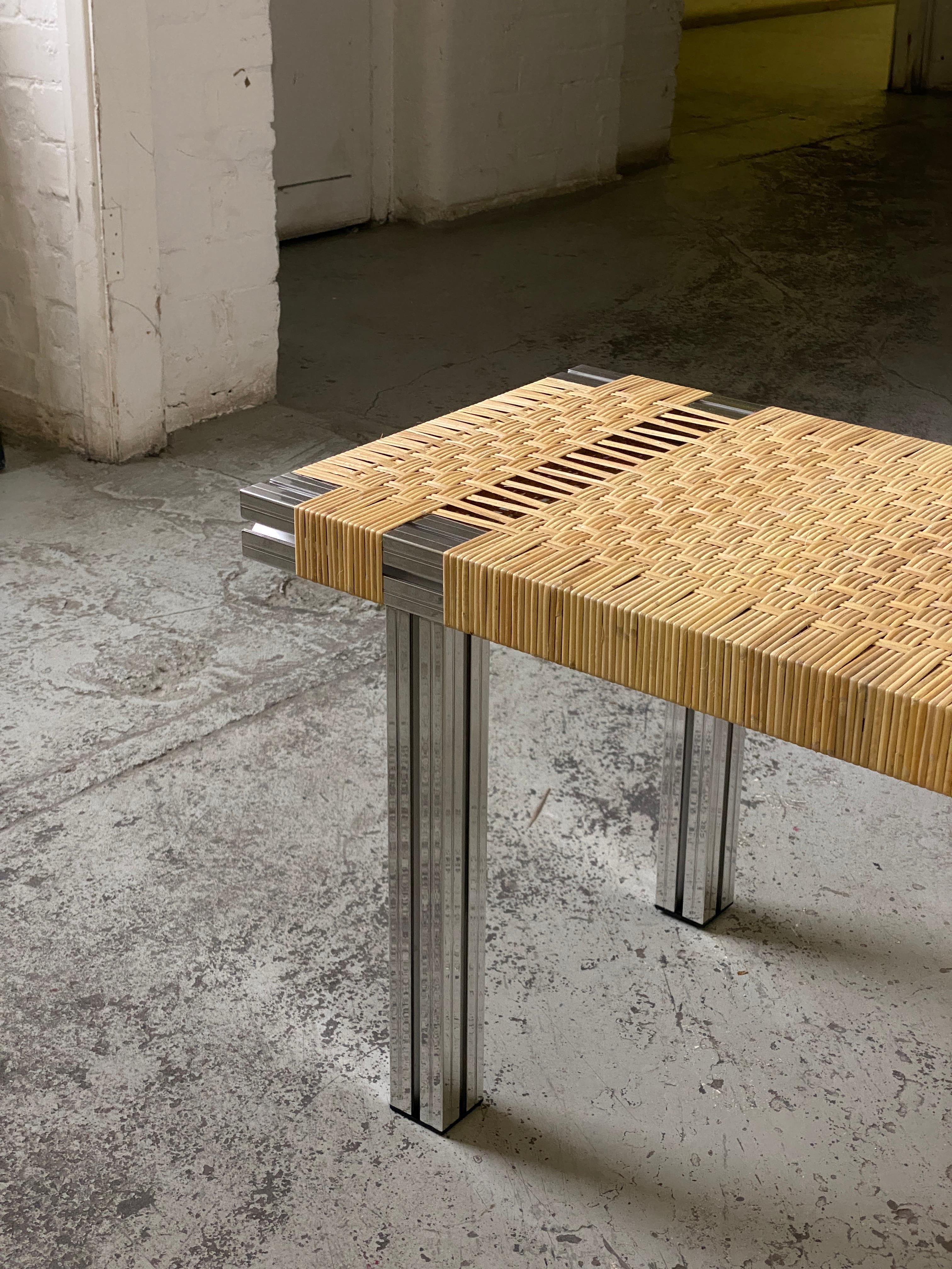 Panchina realizzata con estrusioni di alluminio lucidato a specchio e seduta in canna intrecciata 400 mm x 1450 mm x 450 mm (L x L x H).

Realizzato originariamente per la Hepworth Gallery di Wakefield e ispirato a Donald Judd e Børge Mogensen,