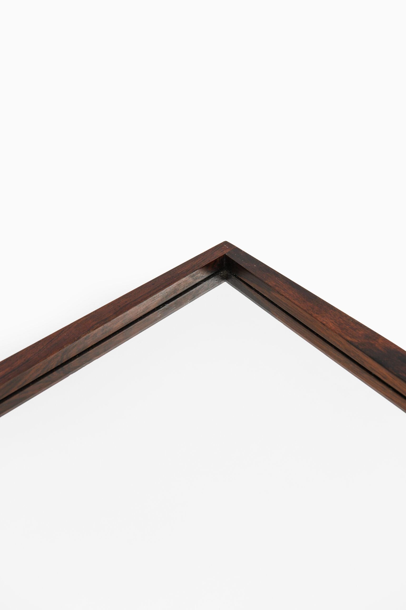 Mirror in rosewood by unknown designer. Produced by Jansen Spejle in Denmark.