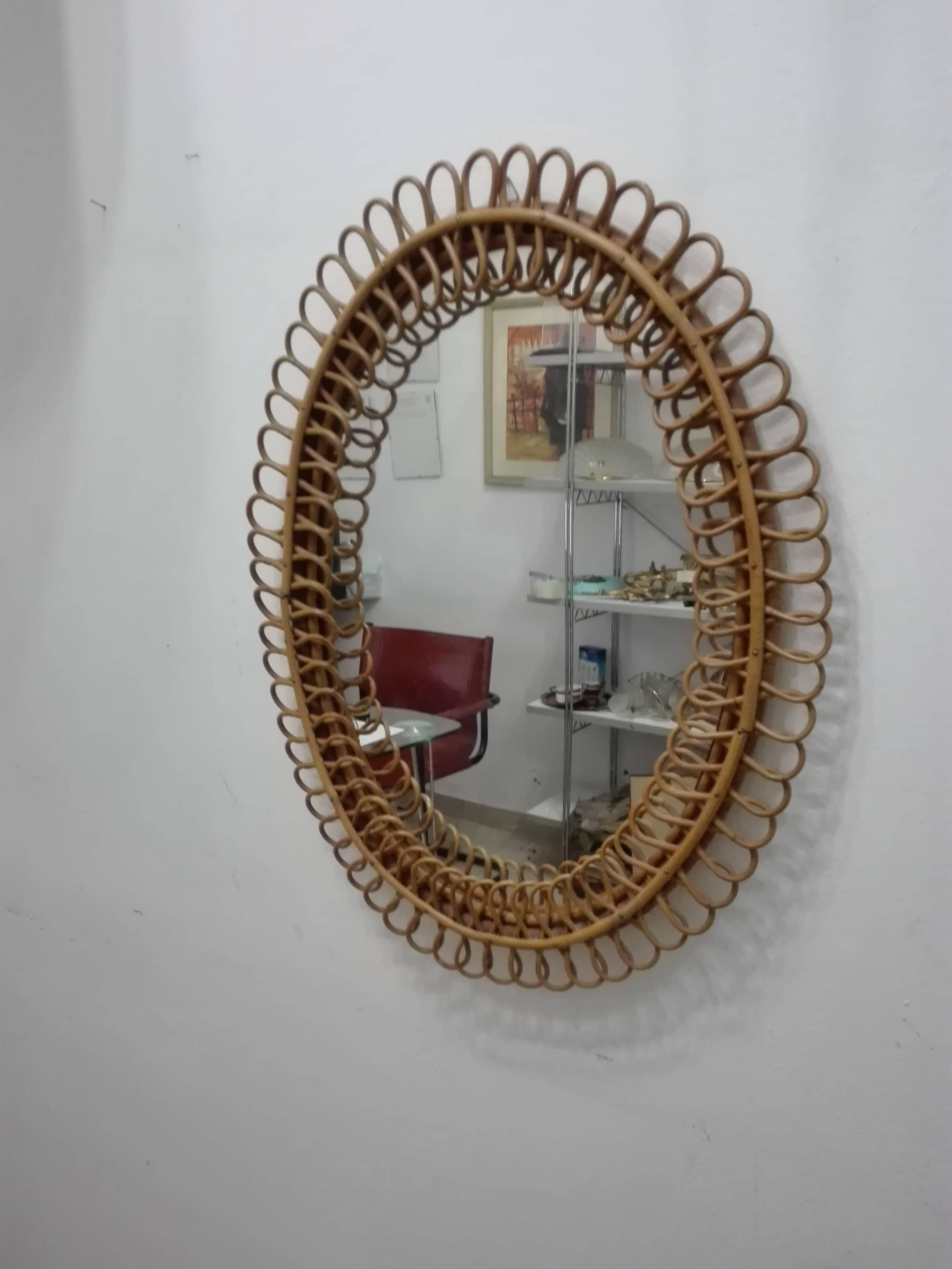 Mirror rattan model in rattan in full style Gio bridges datable in the 20th century, 1950 style deco design. Excellent quality of the wicker or the steamed bamboo handcrafted and in hand, in the style of the famous designer, we immediately speak of