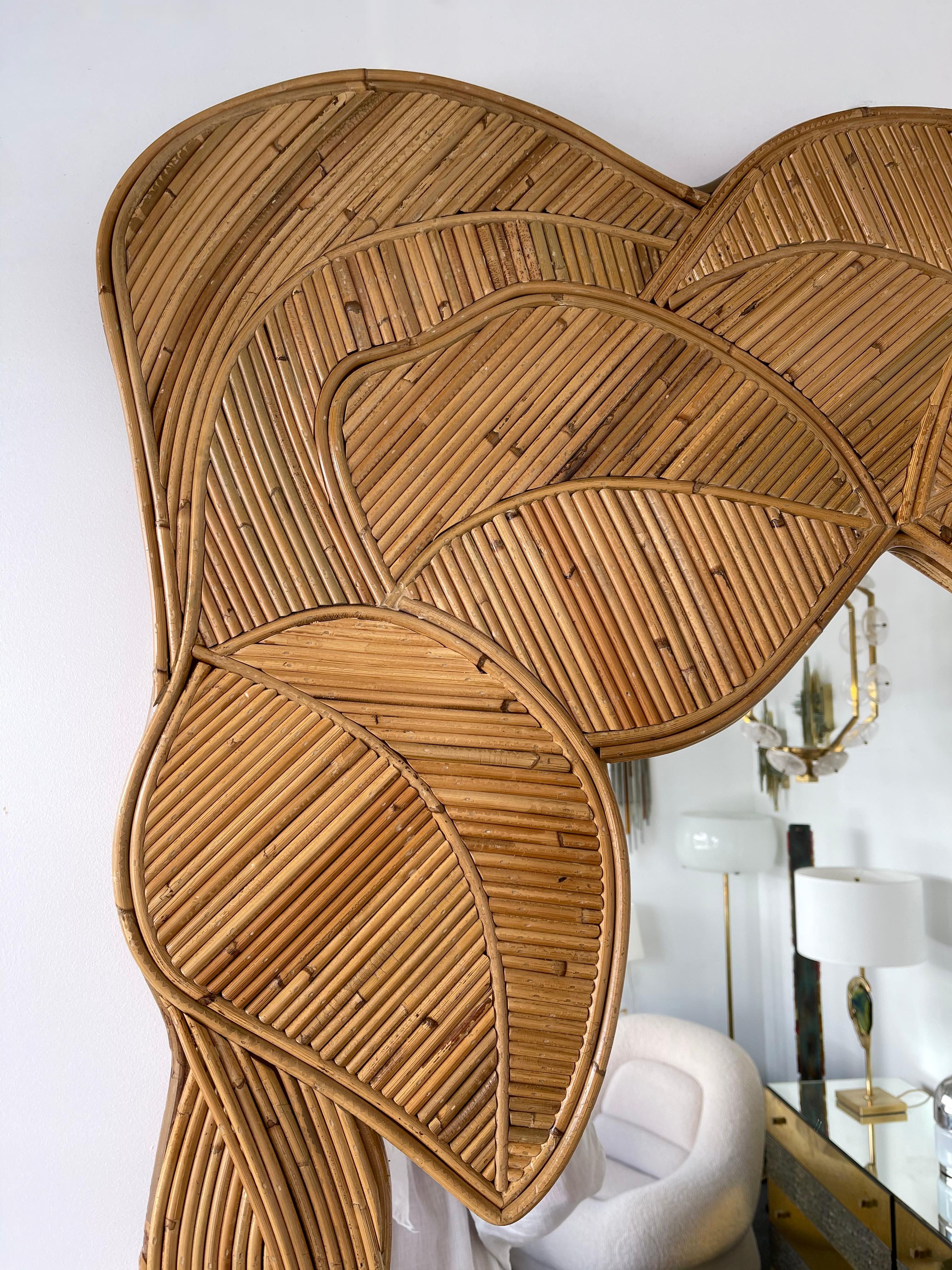 Large wall or trumeau mirror rattan wicker palm tree braided leaf decor. Artisanal work in the style of Mario Lopez Torres, Galerie Maison & Jardin, Jansen, Dal Vera, Vivai Del Sud, Hollywood Regency.

 