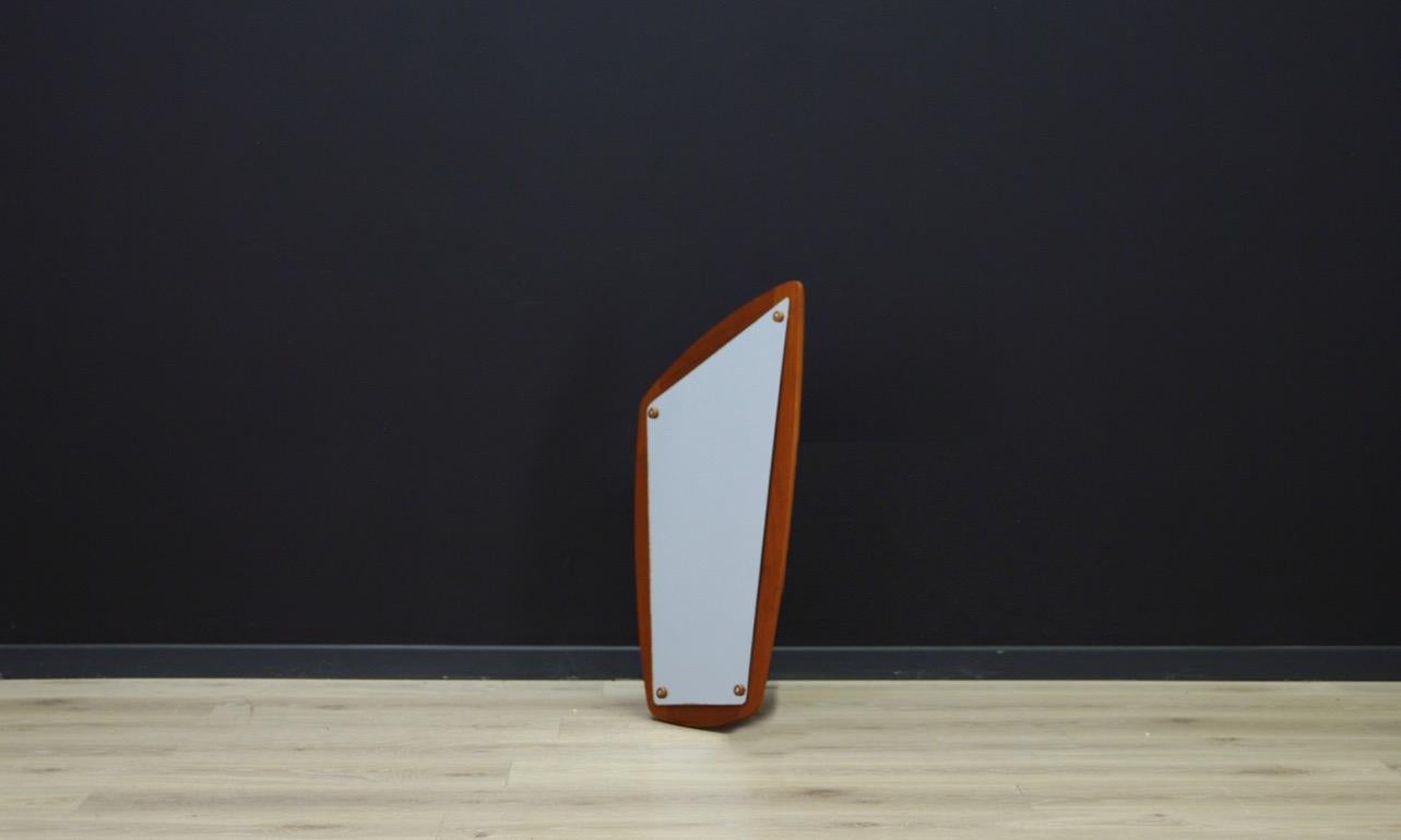 An original mirror from the 1960s-1970s, Scandinavian design, form and expression. A mirror made of teak wood, a sheet without scratches. Preserved in good condition - directly for use.

Dimensions: Height 70.5 cm, width 36.5 cm.