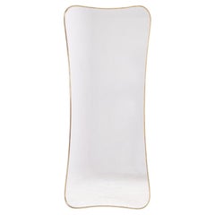 Miroir serti d'une baguette en laiton doré. 1970s.