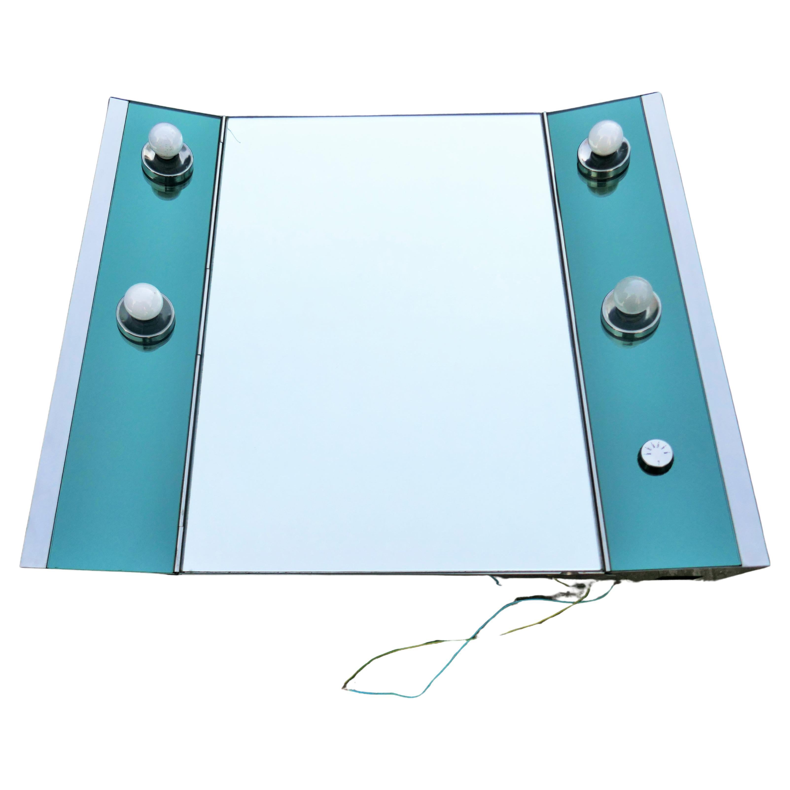 Mirror Veca production 1970 illuminated.
Door with two glass shelves.
Depth 15/11 centimeters
Good condition.
Thanks