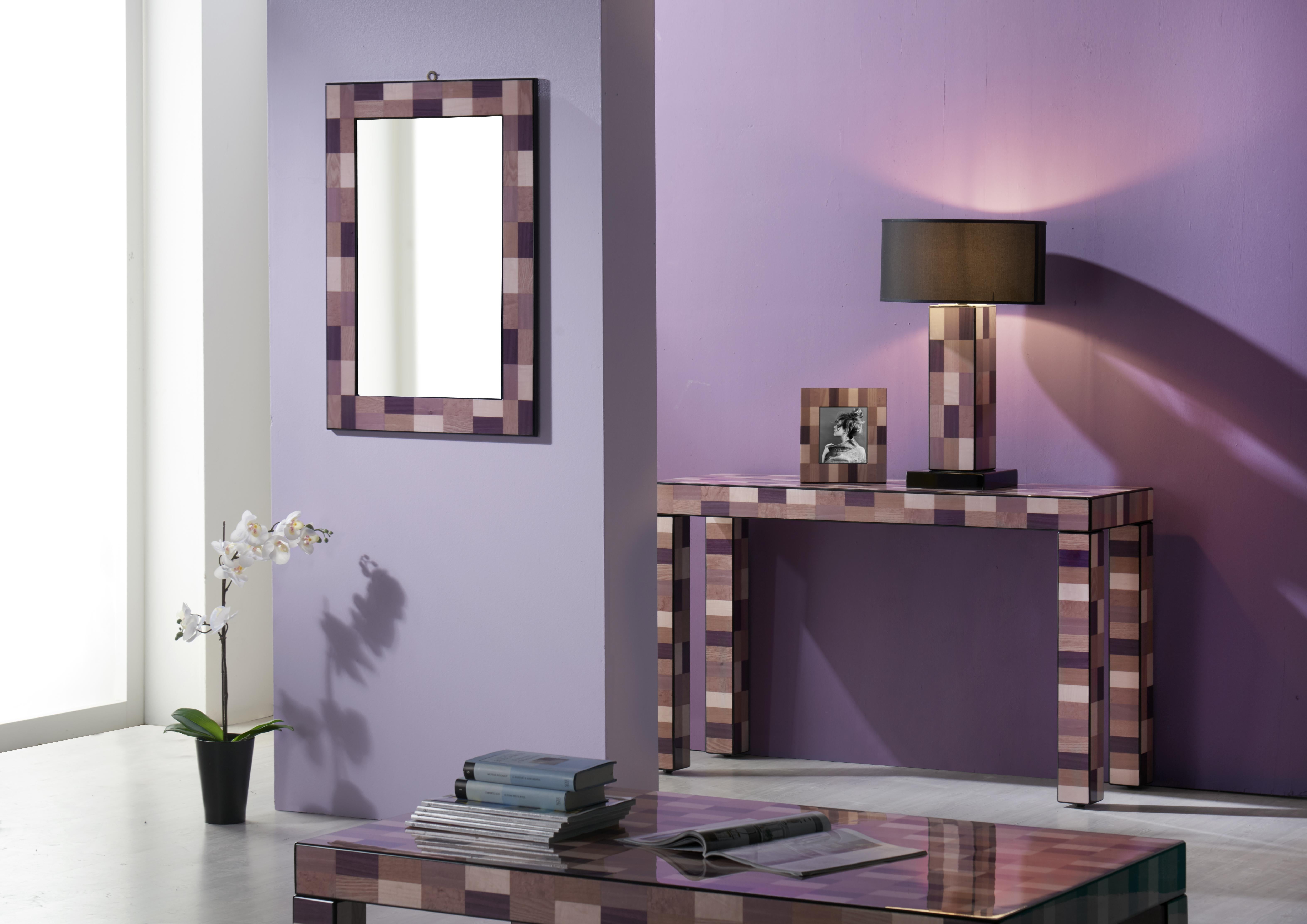 An eye-catching addition to a modern decor, this wall mirror is masterfully crafted, painted, and veneered by expert hands following traditional methods. Its large, rectangular shape is enclosed in an exquisite frame fashioned of mahogany and