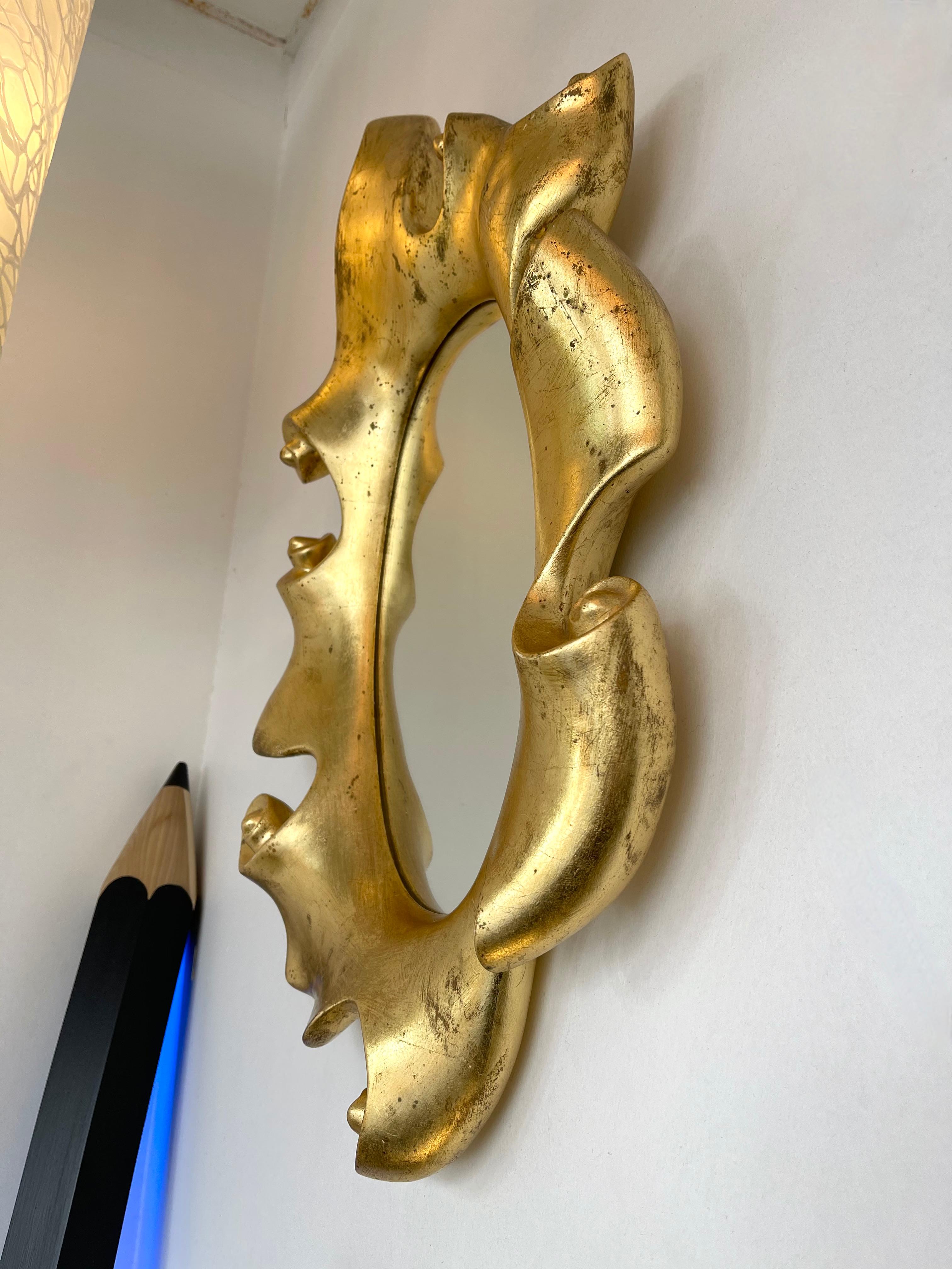 Wall mirror volute in plaster and gold leaf. A 1980s work from the artist Jean Boggio for Les Héritiers. Made in France. Famous design like Garouste et Bonetti, En attendant les Barbares, Franck Evenou, Hubert Le Gall.