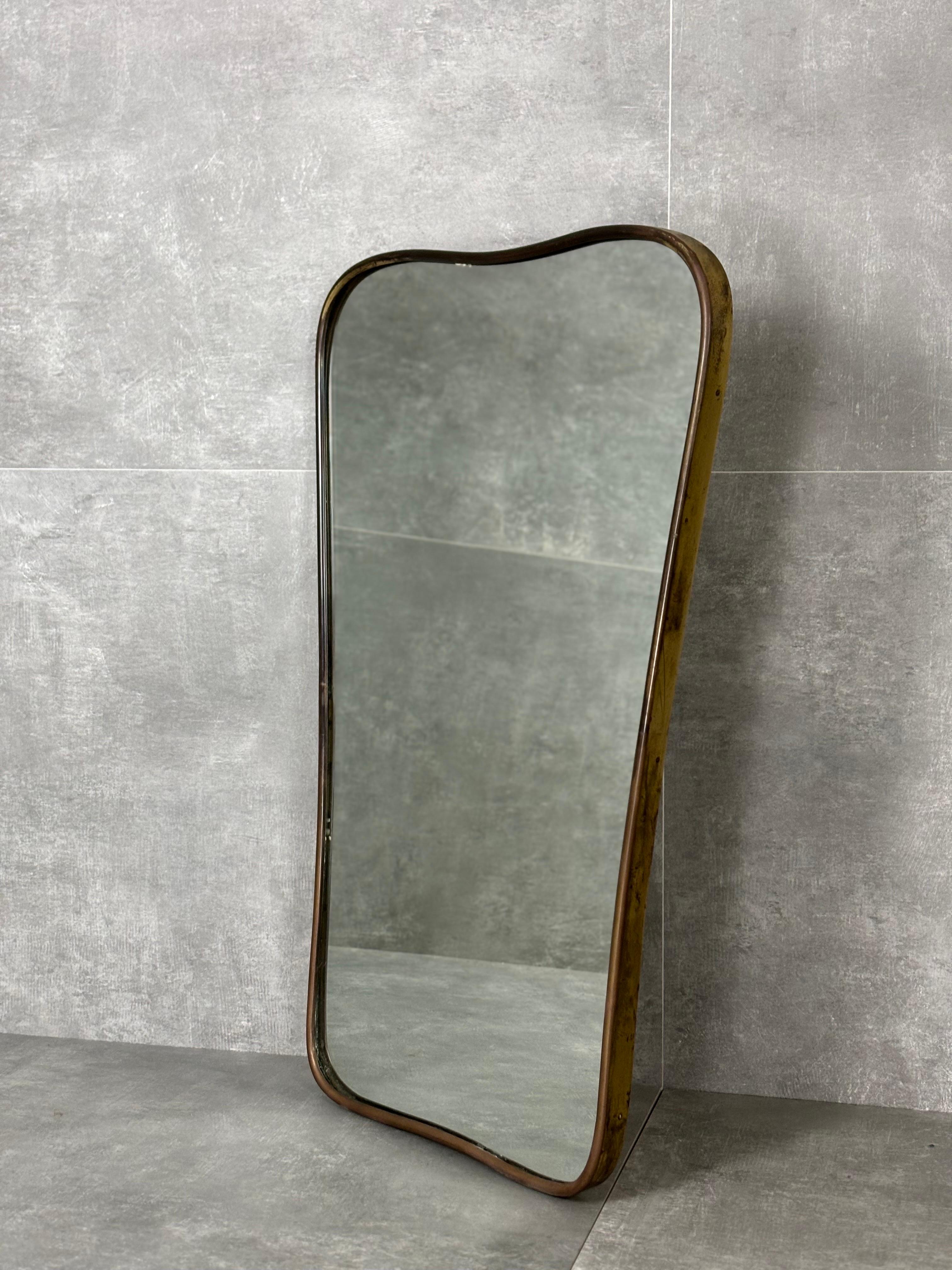 Mirror with brass curved frame, Italy, 1950s.