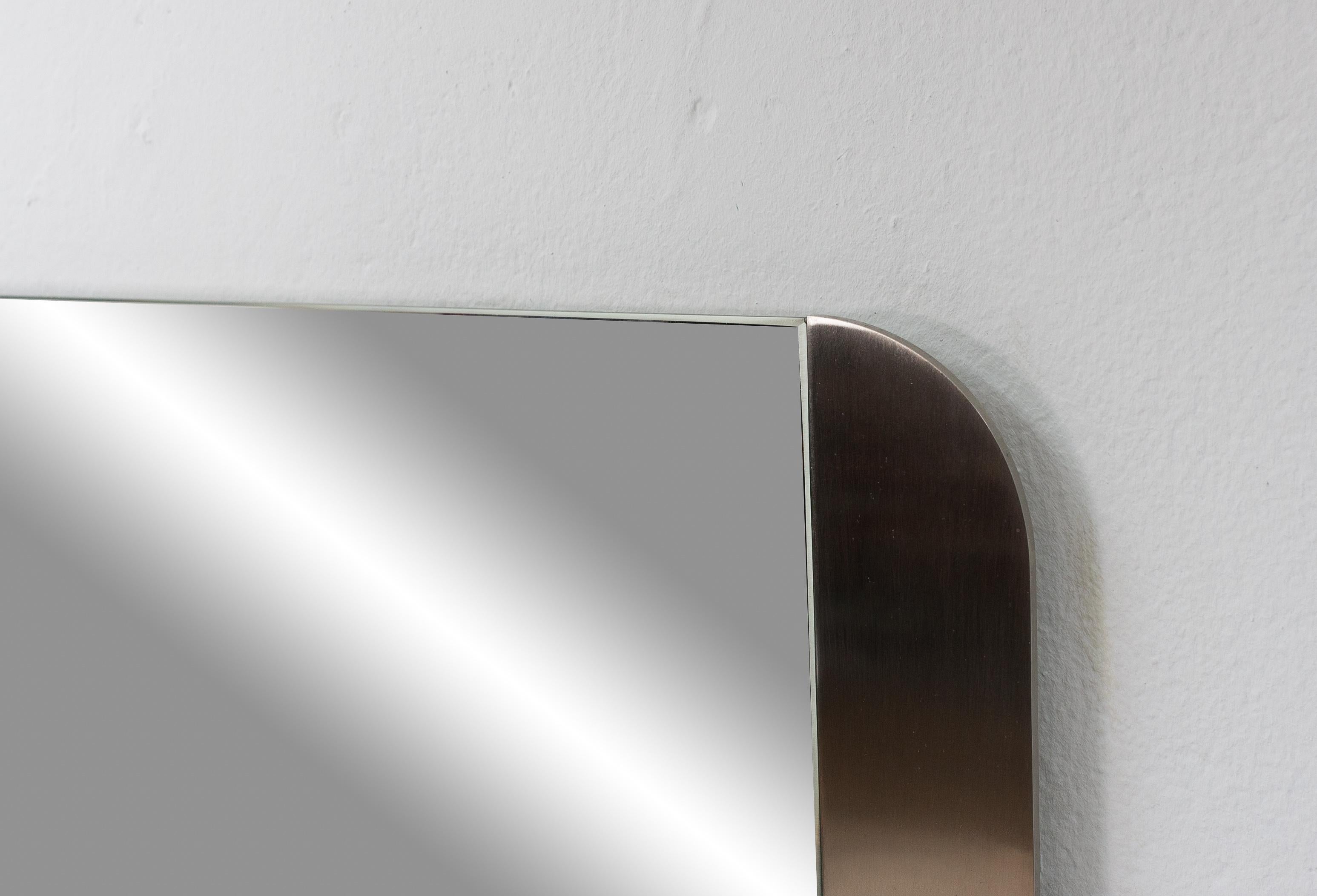 Great, heavy quality cut glass mirror with a brushed aluminum frame, 1970s.

 