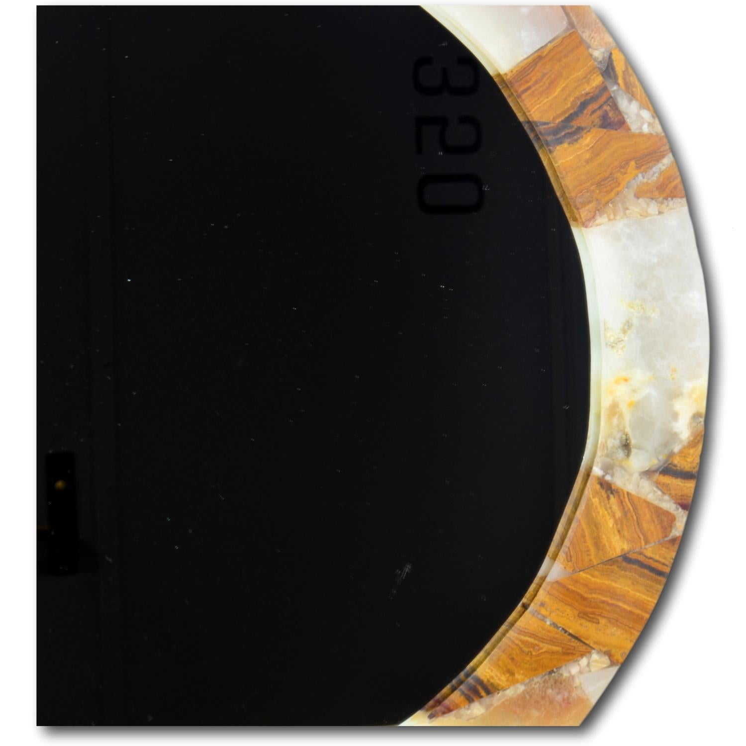 Small round mirror with frame made from onyx.