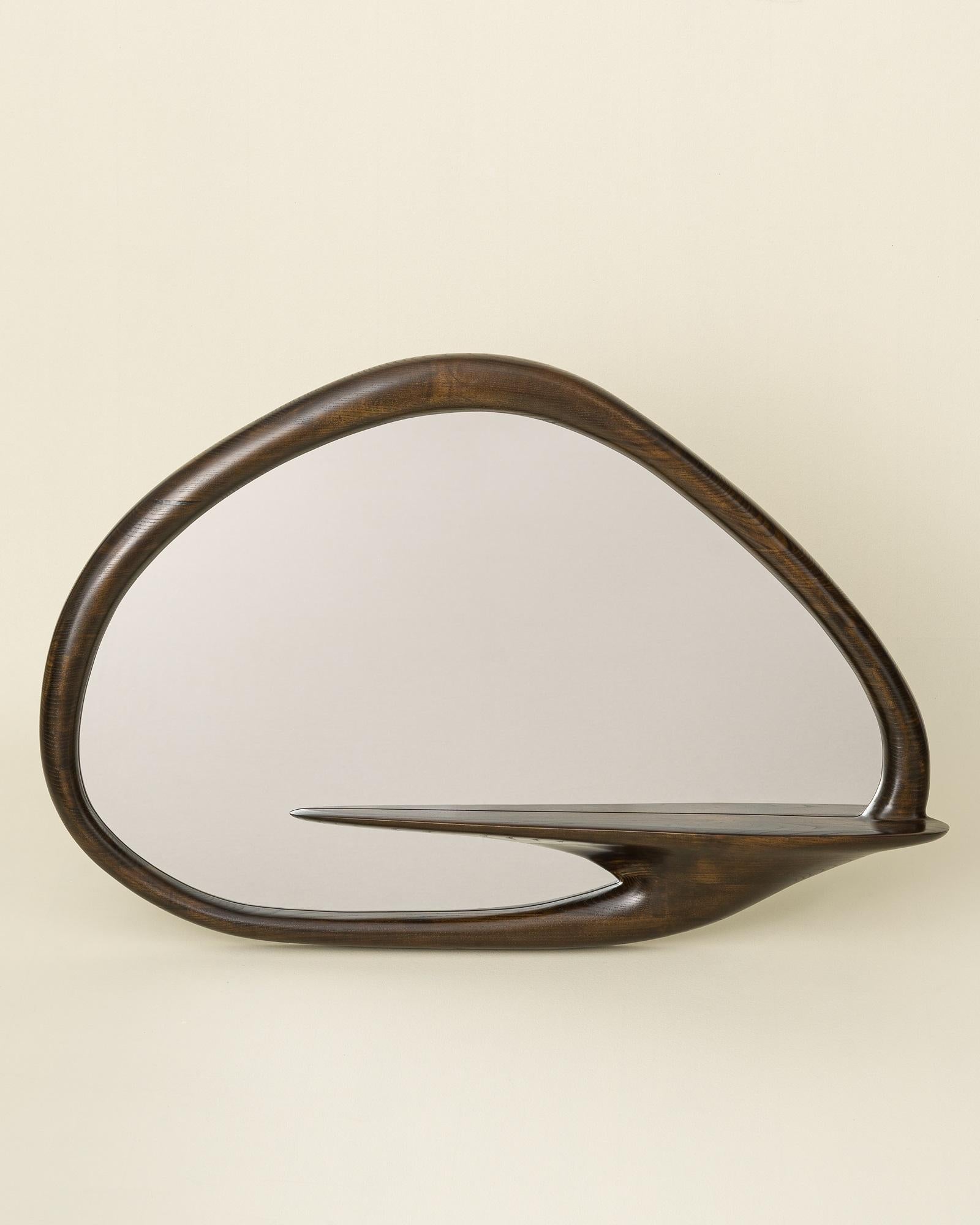 Mirror With Shelf by Tomasz Omachel
Dimensions: D 17 x W 110 x H 76 cm. 
Materials: Ash and glass.

Available in different wood options: oak, ash, and American walnut. Different finishes available: Lacquer/Oil and wood surface treatments: natural or