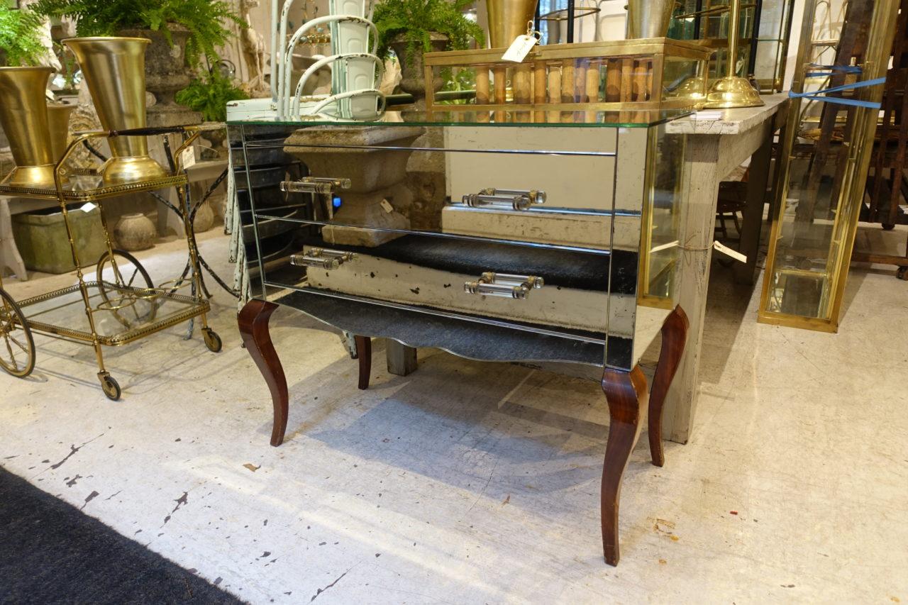 Elegant French Venetian mirror side board / dresser / commode, with beautiful curved legs. Dating back to the 1920s, and covered with vintage original mirrored glass and molded glass rod handles.
