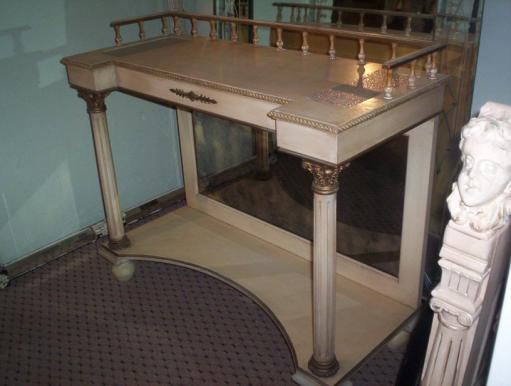 A mirrored back Italian wood console with fluted columns.