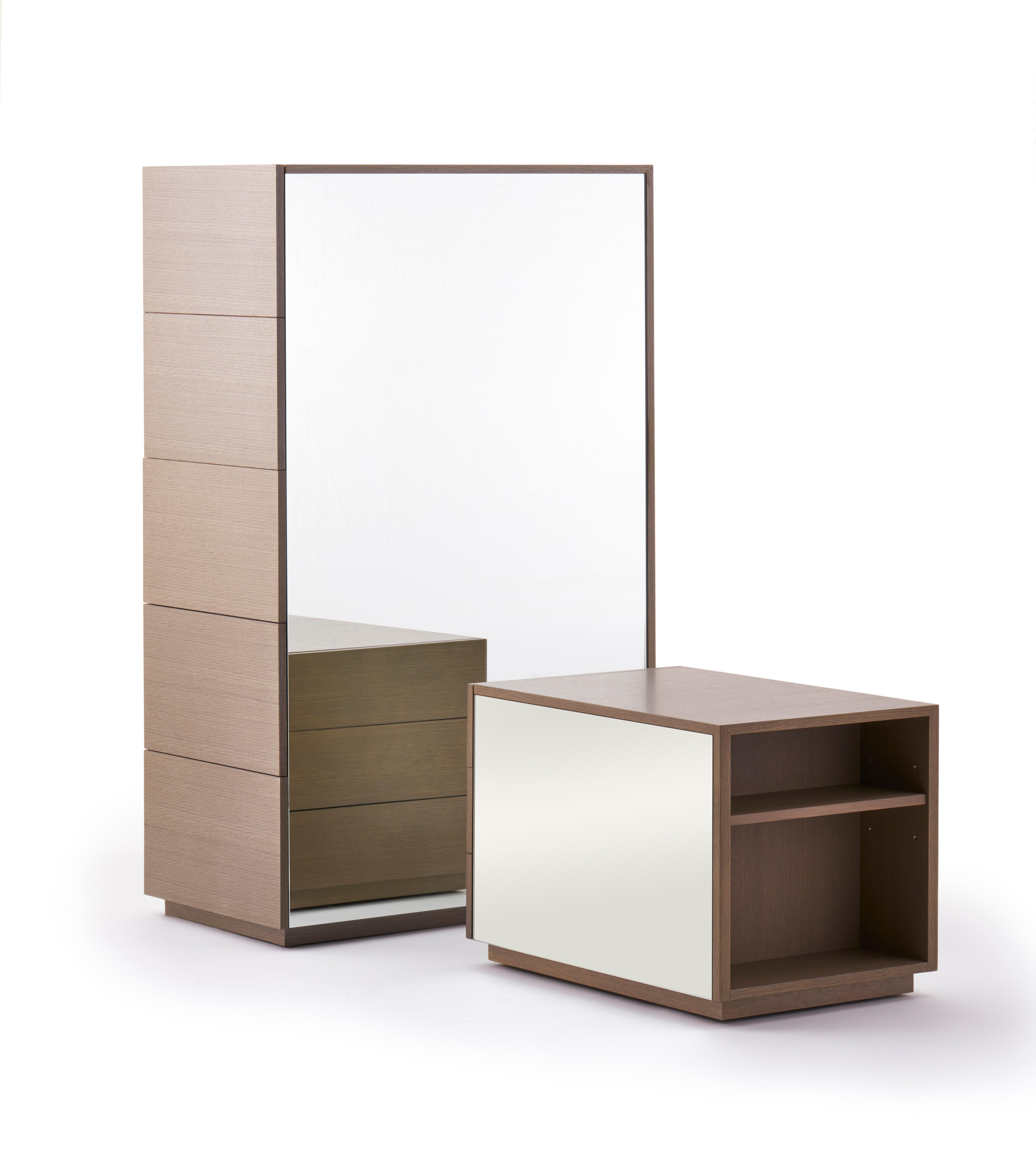 No. CG-001

The Mirrored Cabinet packs a lot of functions into one unit. Available with drawers or shelves accessible from the sides, it has a mirrored front and bacl, reflecting light and movement in the space. 

Its mirrored surfaces comes alive