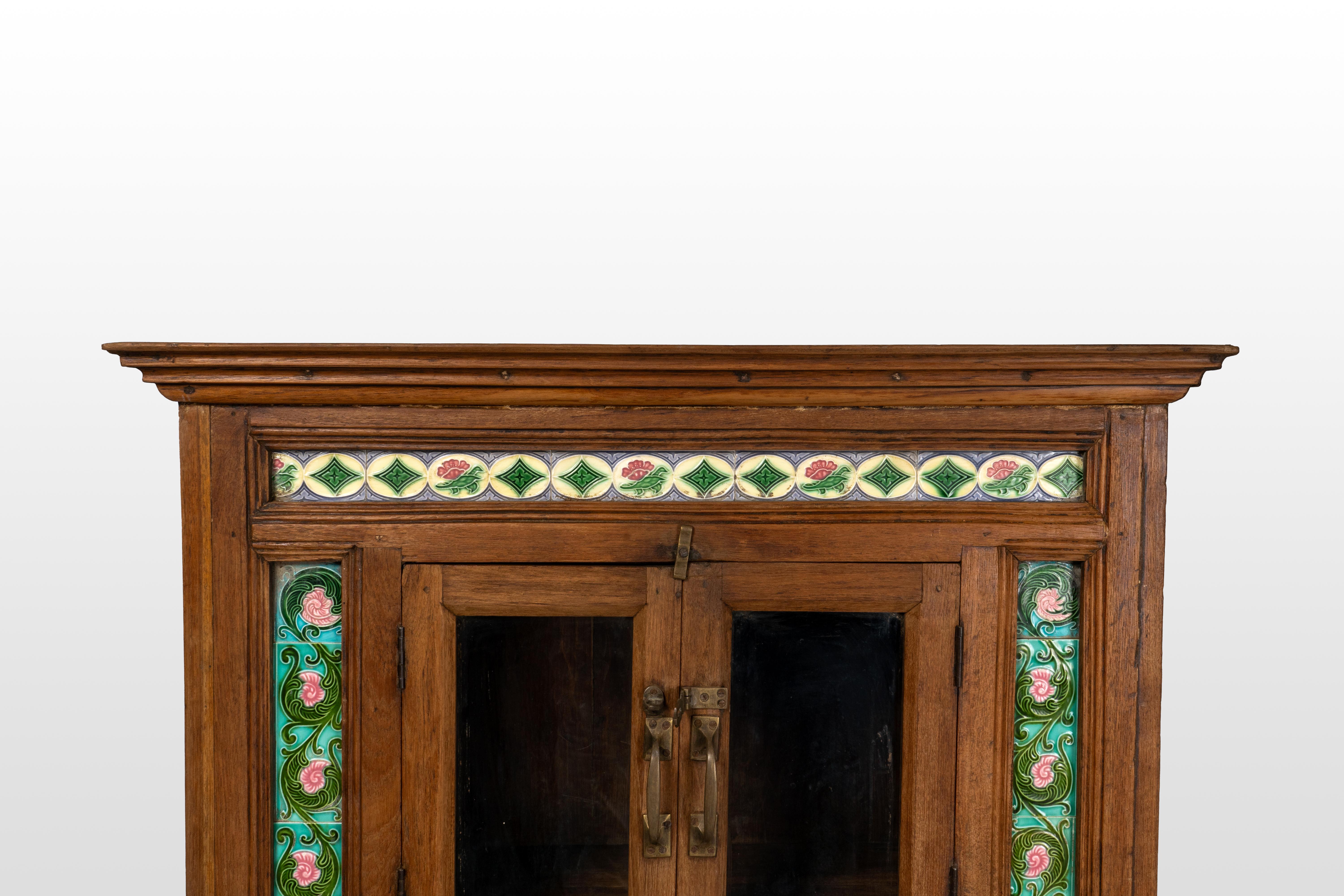 A British Colonial Cabinet with Green Decorative Floral Tiles In Good Condition In Chicago, IL