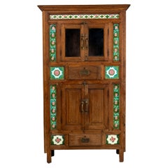 A British Colonial Cabinet with Green Decorative Floral Tiles