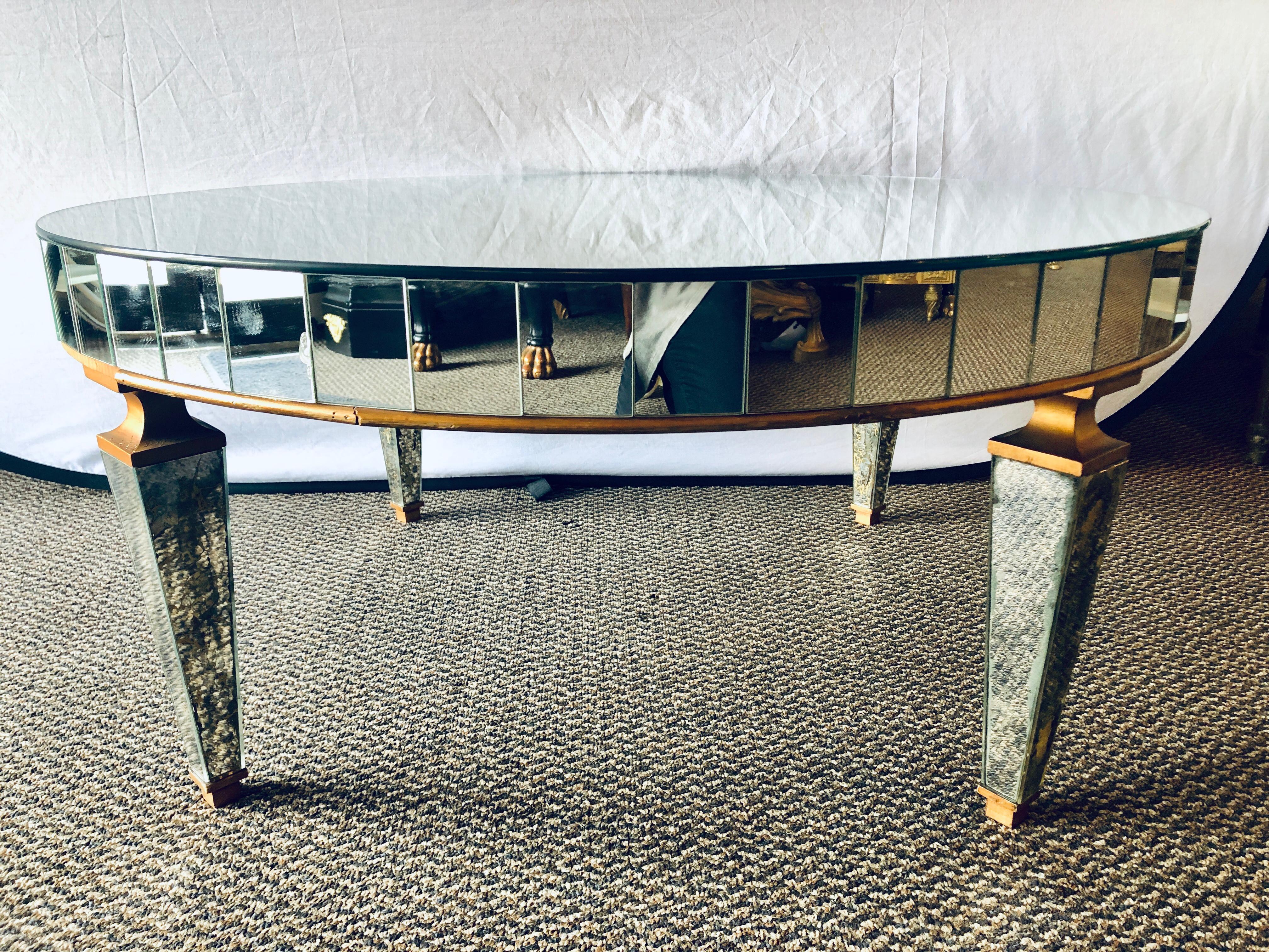 Mirrored circular Art Deco style coffee or low table in a distressed look.