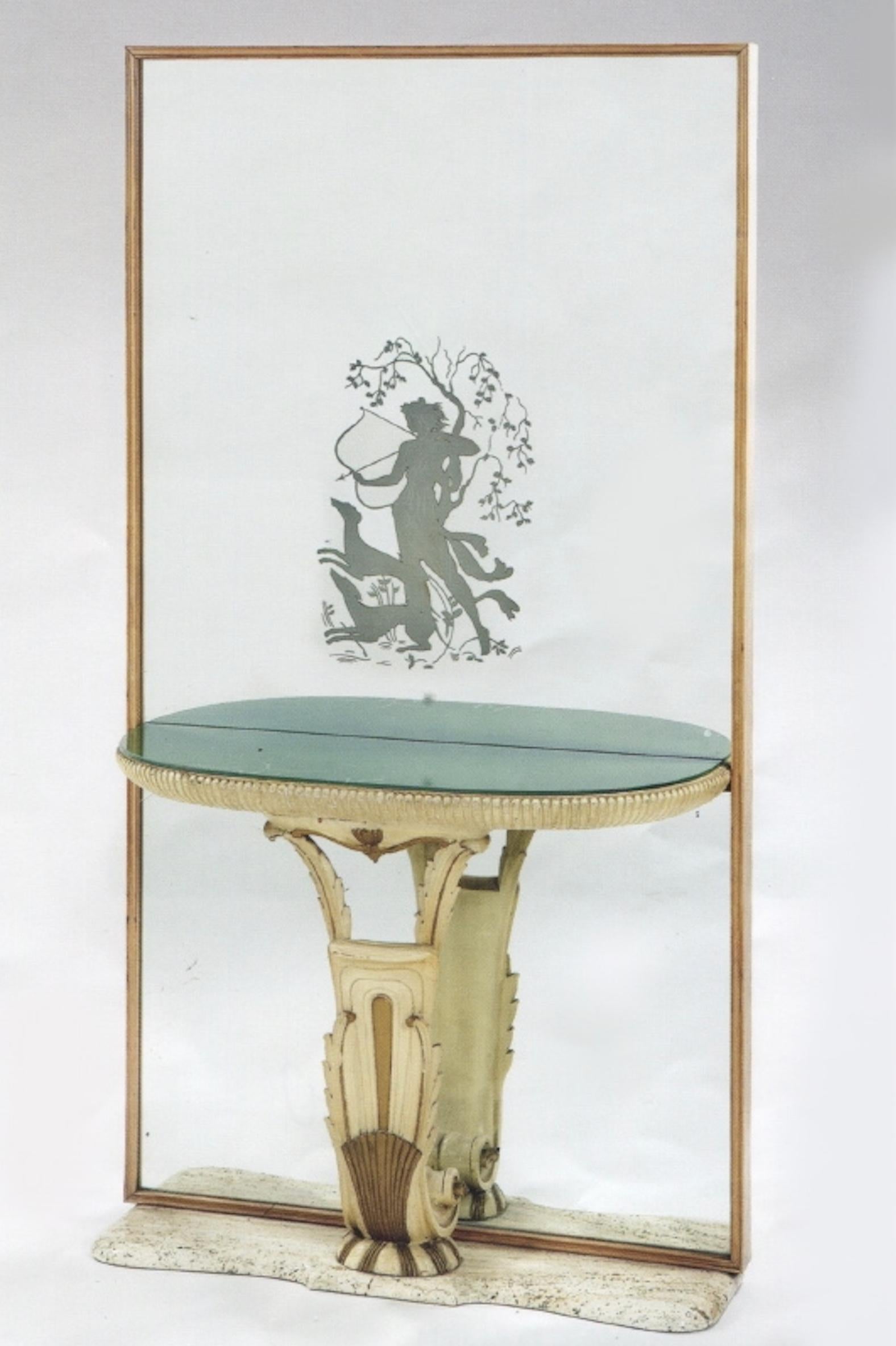 Mirrored glass panel, etched with a depiction of the mythical huntress Diana, fixed with a carved and painted demilune shelf inset with a green glass and raised on a limestone base. Stamped Fontana Arte on the underside of the glass. 

OUR